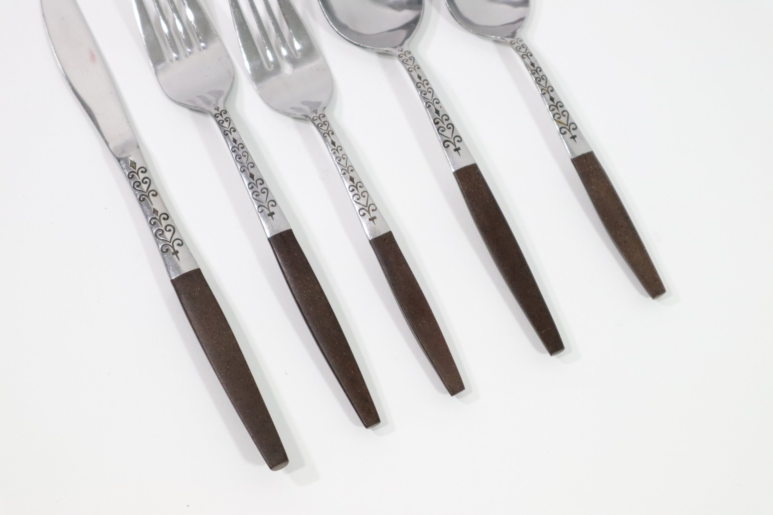 Vintage 1960s 36-piece Interpur Japan stainless steel and composite wood flatware set. Includes 8 dinner forks, 8 salad forks, 8 teaspoons, 2 tablespoons, and 10 knives.