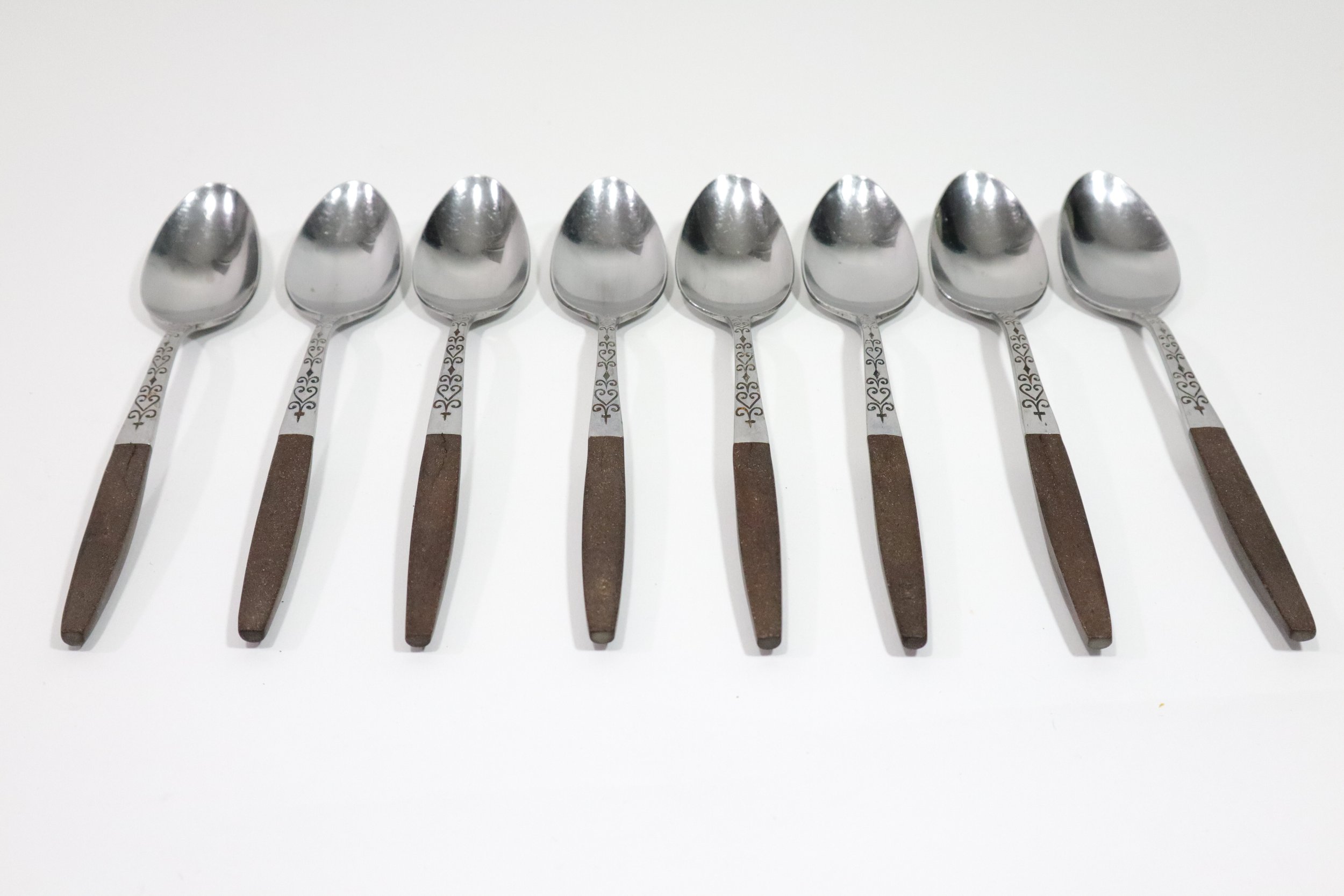 Vintage 1960s 36-piece Interpur Japan stainless steel and composite wood flatware set. Includes 8 dinner forks, 8 salad forks, 8 teaspoons, 2 tablespoons, and 10 knives.