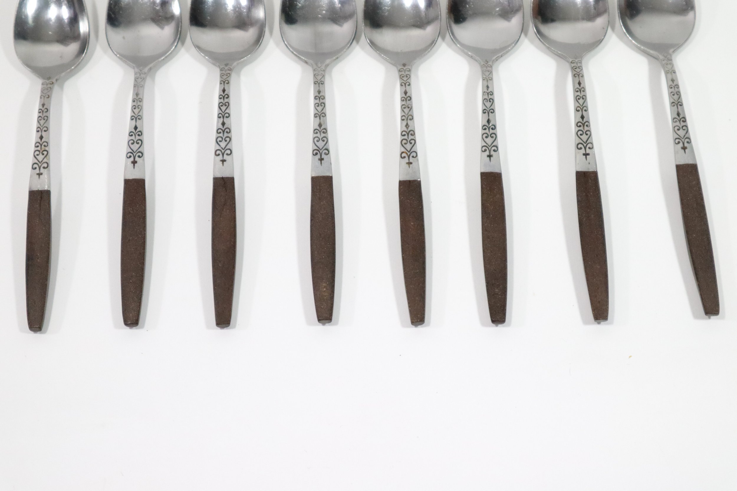 Vintage 1960s 36-piece Interpur Japan stainless steel and composite wood flatware set. Includes 8 dinner forks, 8 salad forks, 8 teaspoons, 2 tablespoons, and 10 knives.