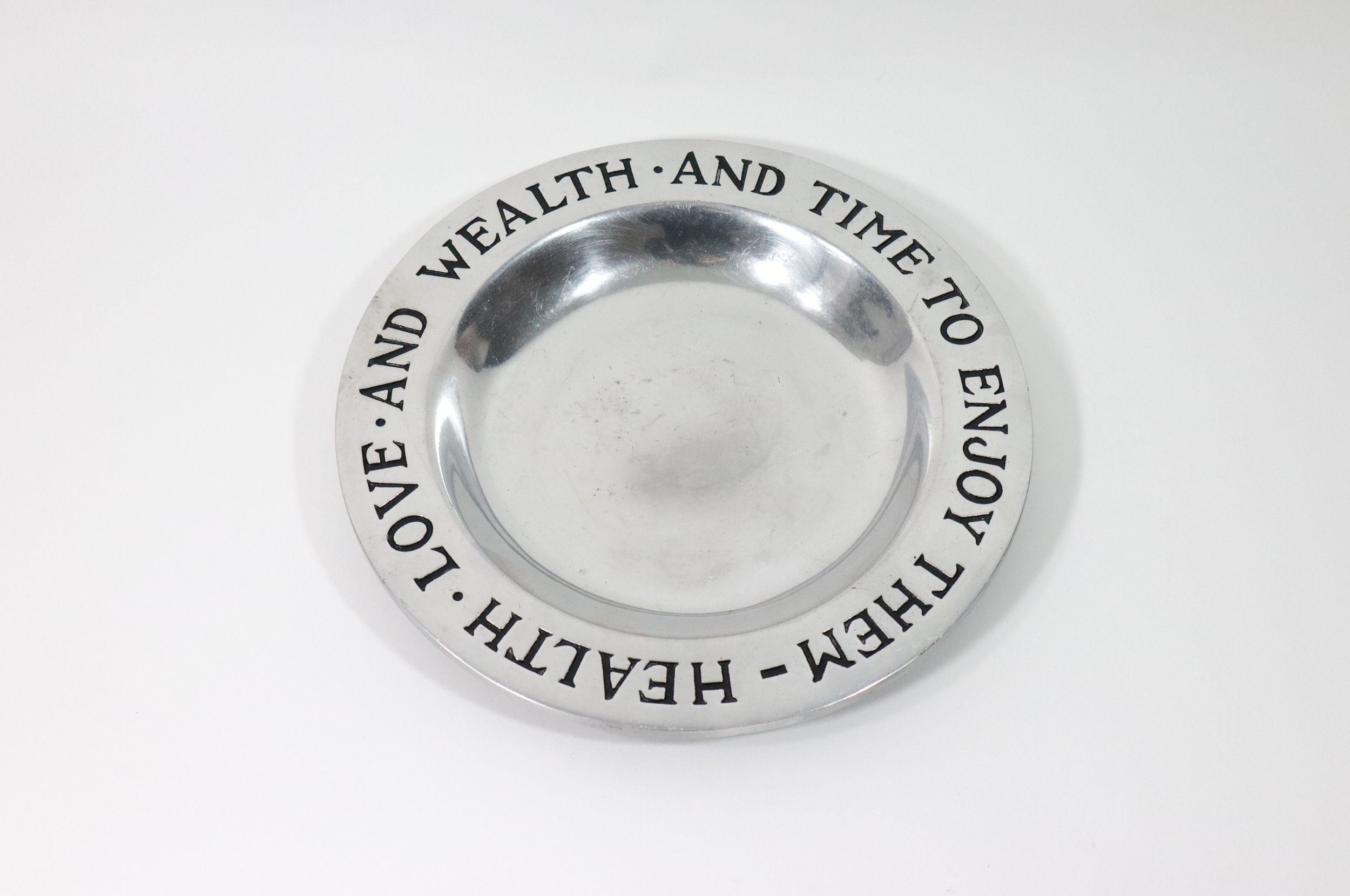 Vintage Wilton "Health, Love, and Wealth, and Time to Enjoy Them" round pewter plate.