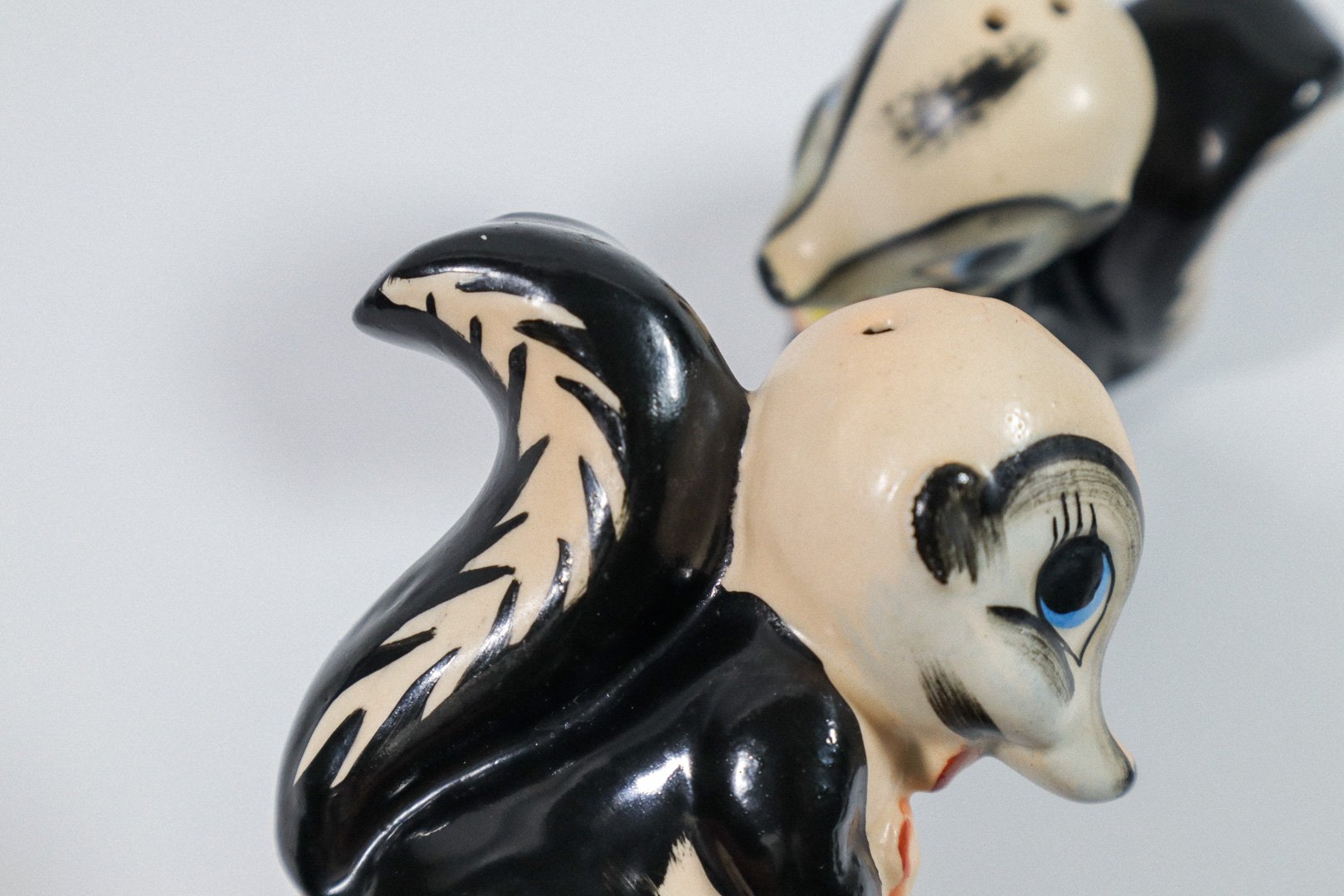 Set (2) of vintage German handpainted skunk salt and pepper shakers.