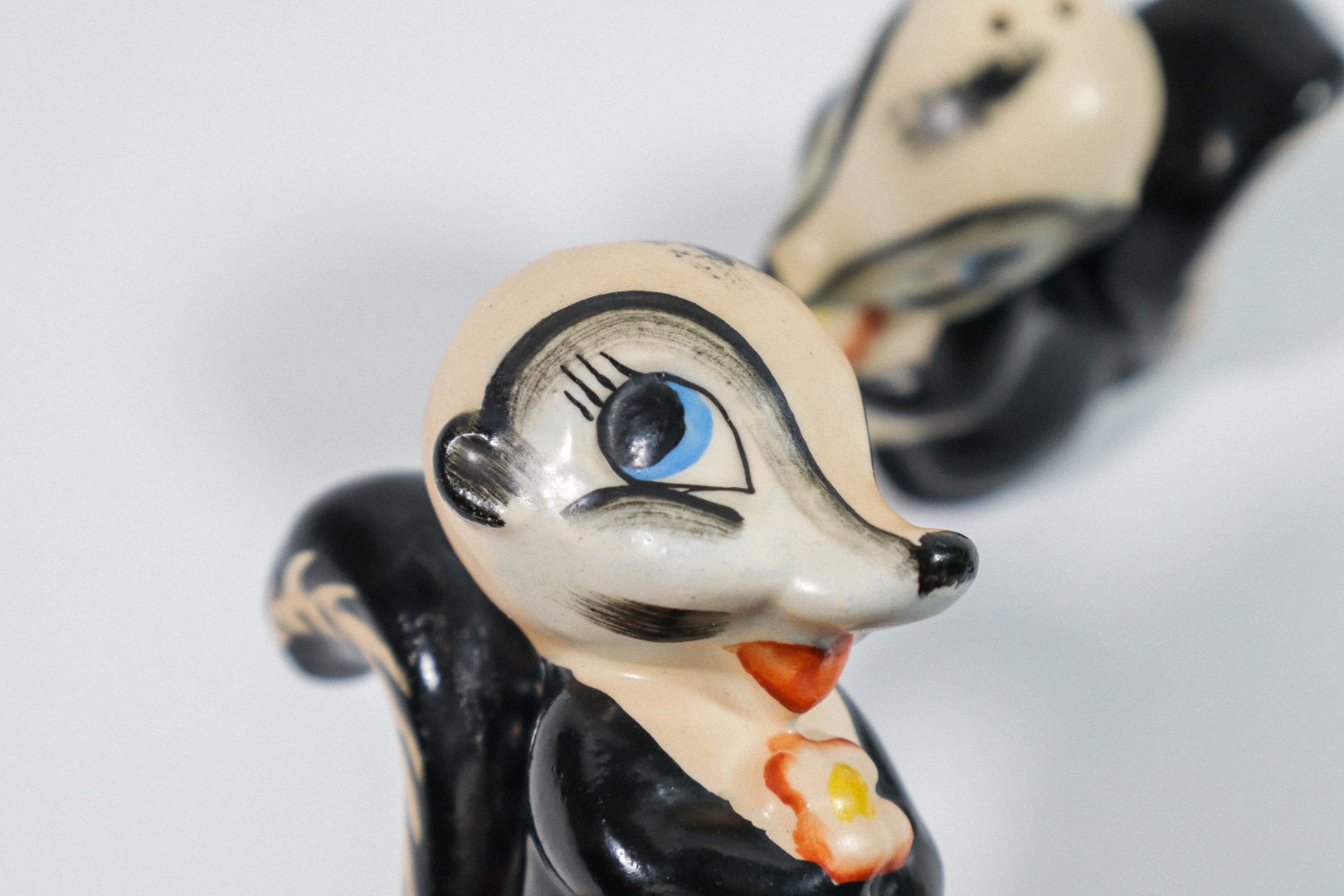 Set (2) of vintage German handpainted skunk salt and pepper shakers.