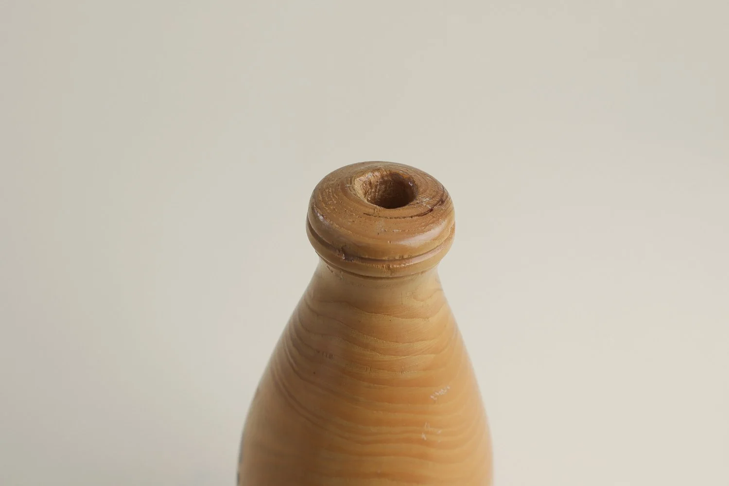 Vintage hand-turned spruce wood bud vase. Signed on the bottom by the maker R. Cooper, dated 3/10/96.