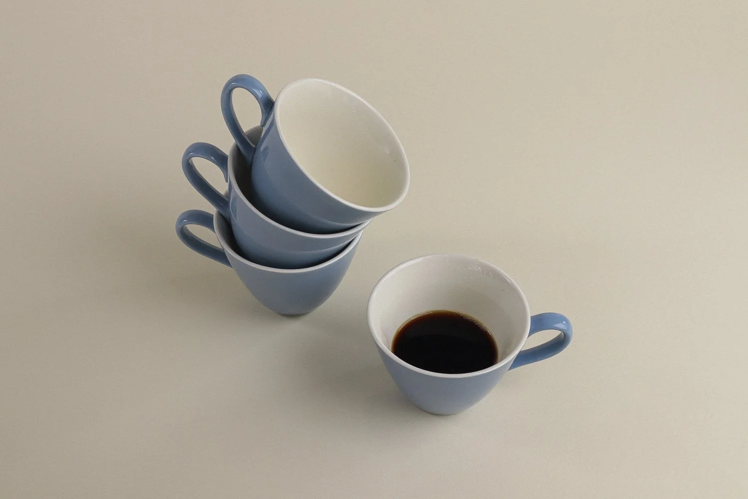 Set (4) of vintage mid-century teacups in a beautiful shade of sky blue with white interiors.