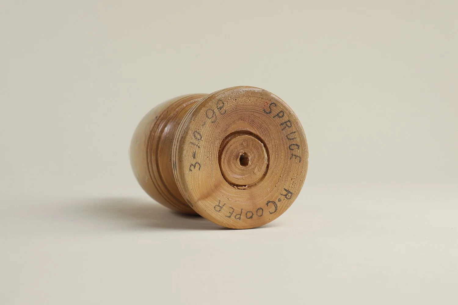 Vintage hand-turned spruce wood bud vase. Signed on the bottom by the maker R. Cooper, dated 3/10/96.