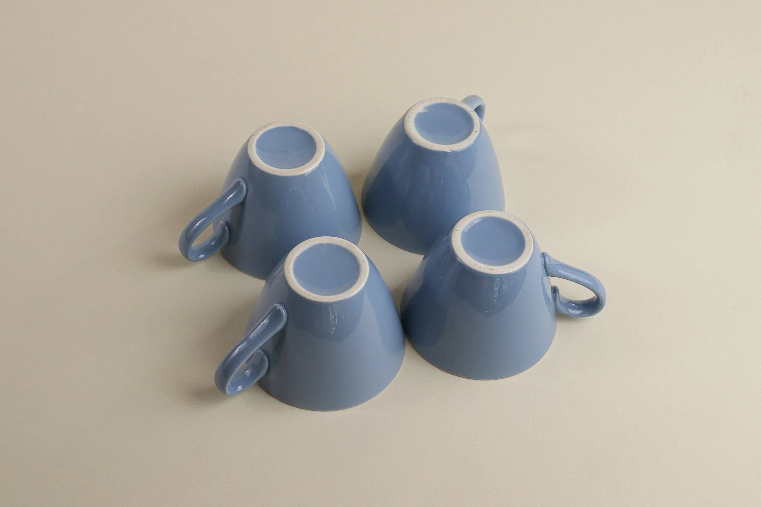 Set (4) of vintage mid-century teacups in a beautiful shade of sky blue with white interiors.