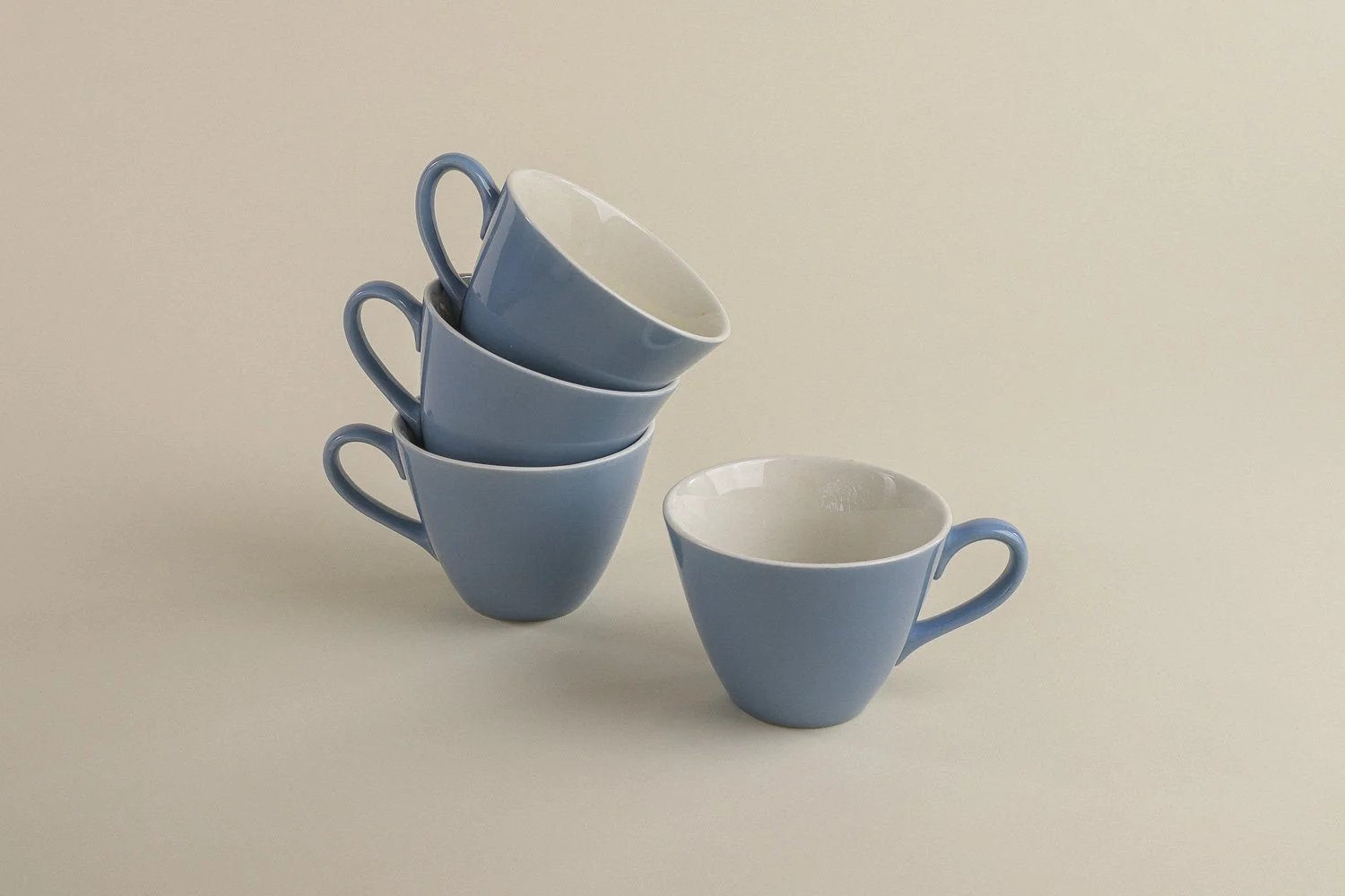 Set (4) of vintage mid-century teacups in a beautiful shade of sky blue with white interiors.