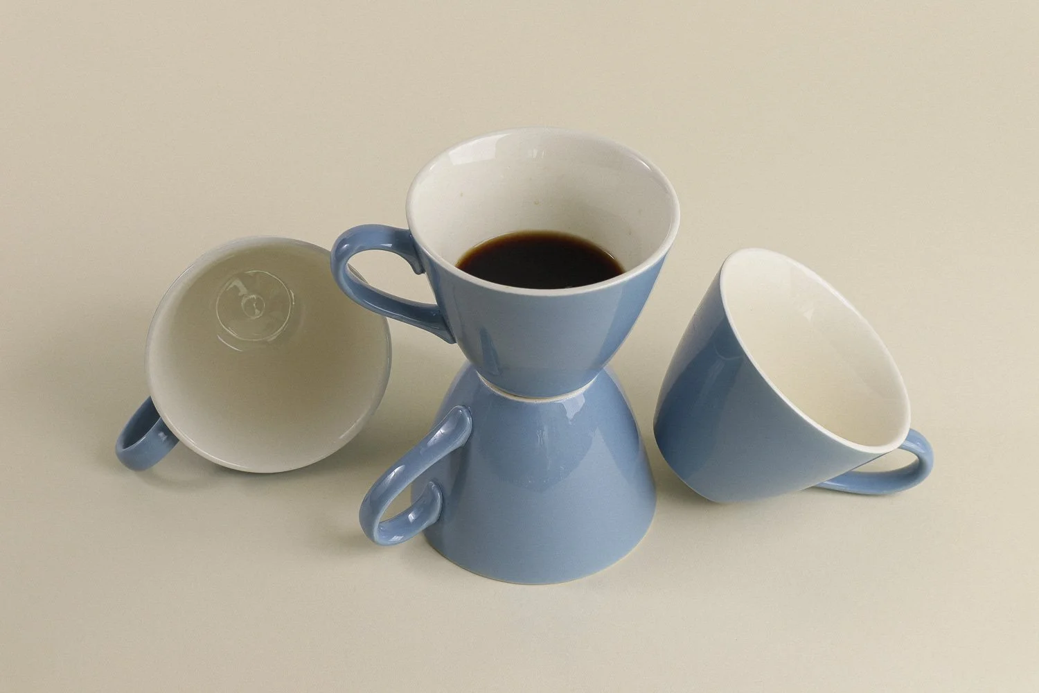 Set (4) of vintage mid-century teacups in a beautiful shade of sky blue with white interiors.
