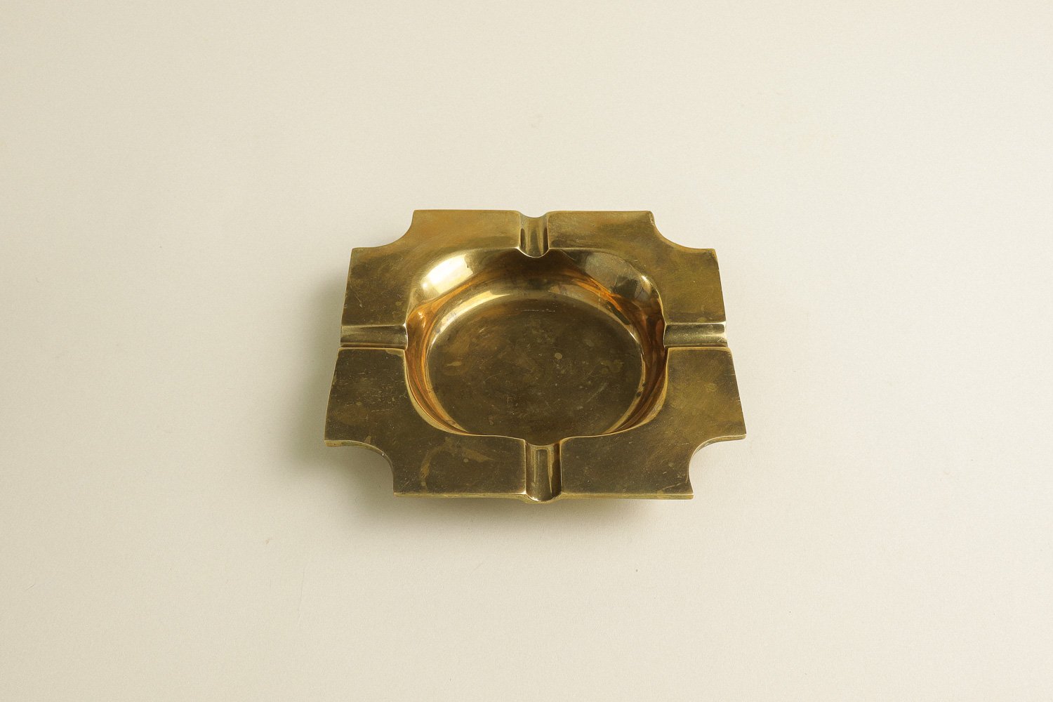 Vintage square solid brass ashtray with four notches. Weighty with a lovely natural patina.