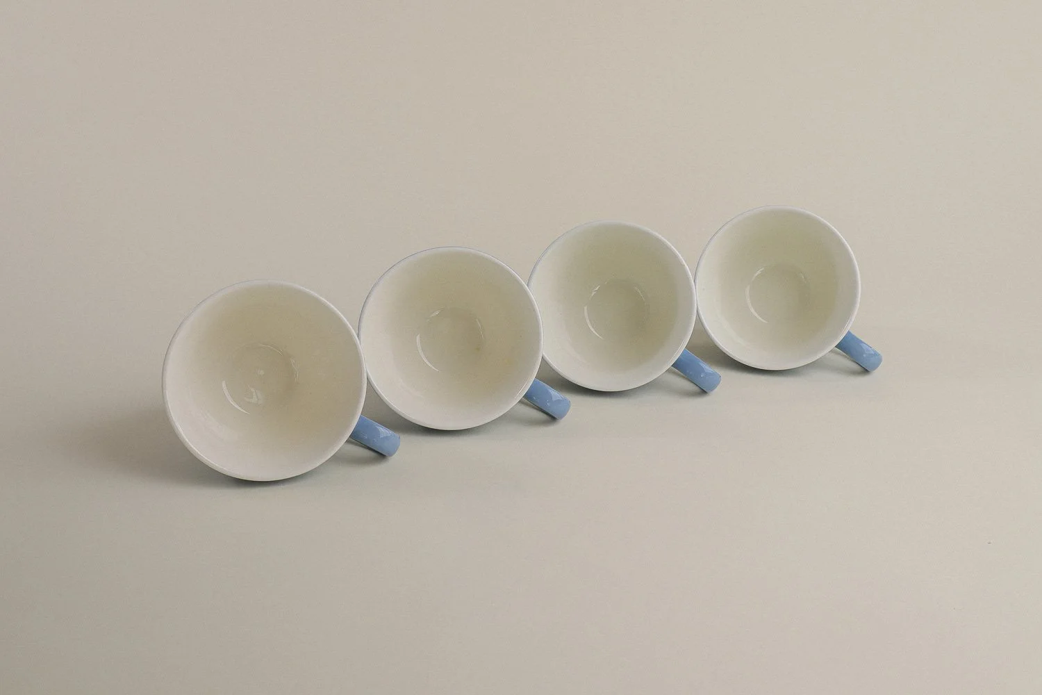 Set (4) of vintage mid-century teacups in a beautiful shade of sky blue with white interiors.