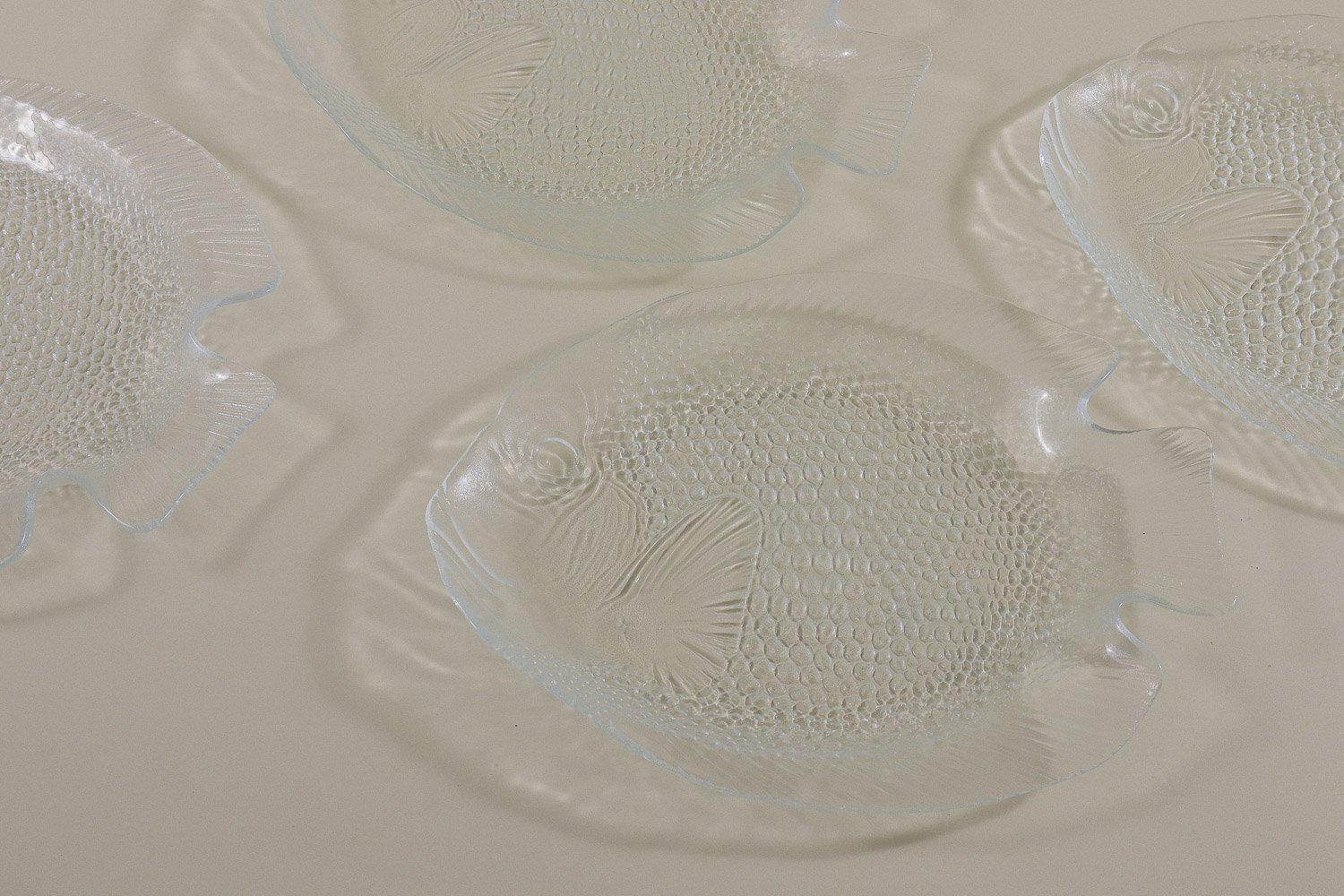 Vintage set (4) of Arcoroc France clear glass fish plates.