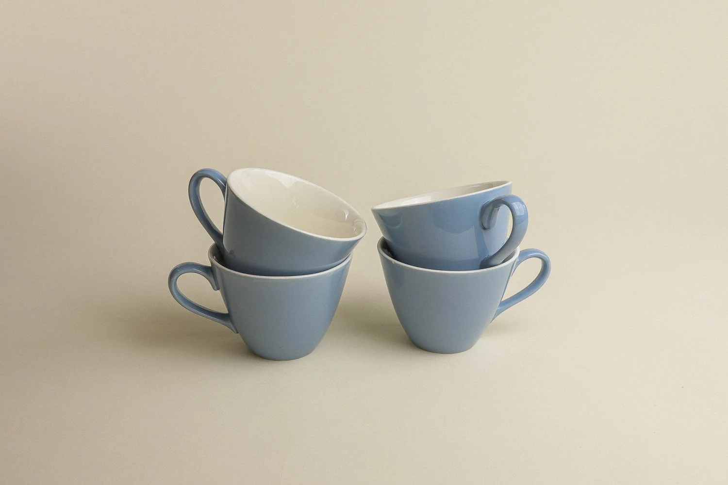 Set (4) of vintage mid-century teacups in a beautiful shade of sky blue with white interiors.