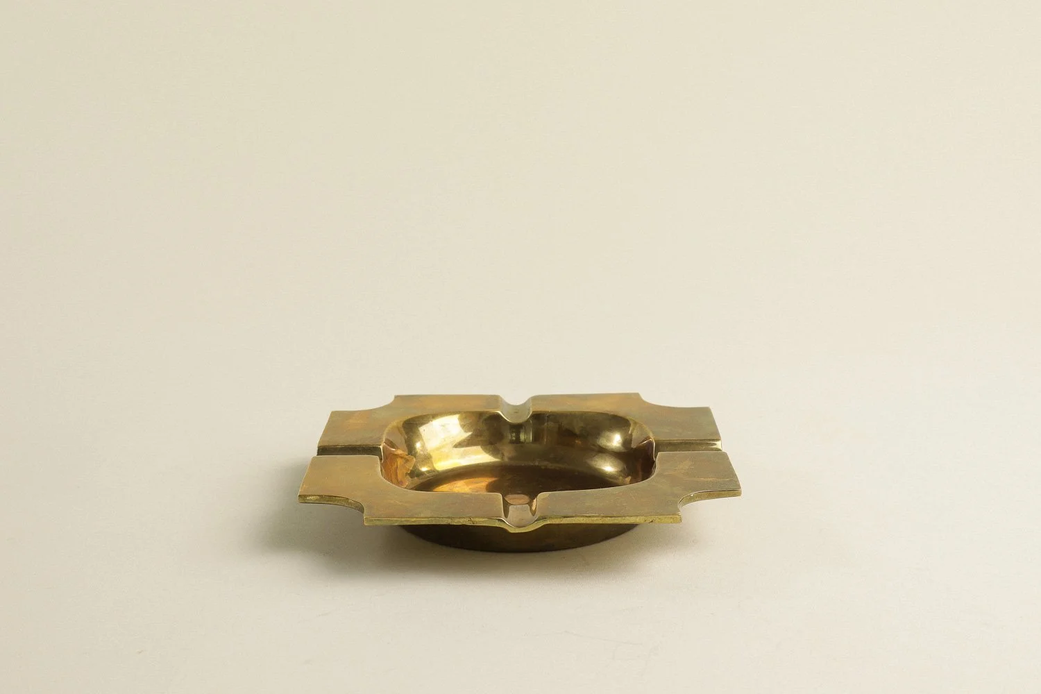 Vintage square solid brass ashtray with four notches. Weighty with a lovely natural patina.
