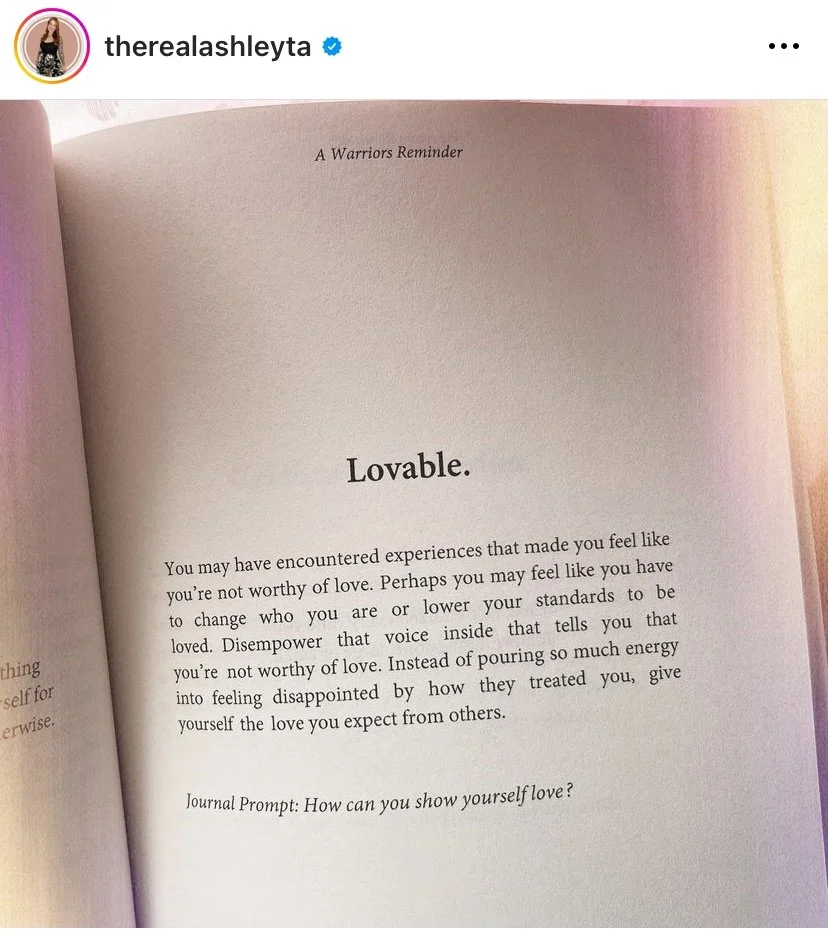A page from a journal titled 'A Warriors Reminder' with the heading 'Lovable.' The text advises on self-love and giving oneself the love expected from others, ending with a journal prompt: 'How can you show yourself love?'
