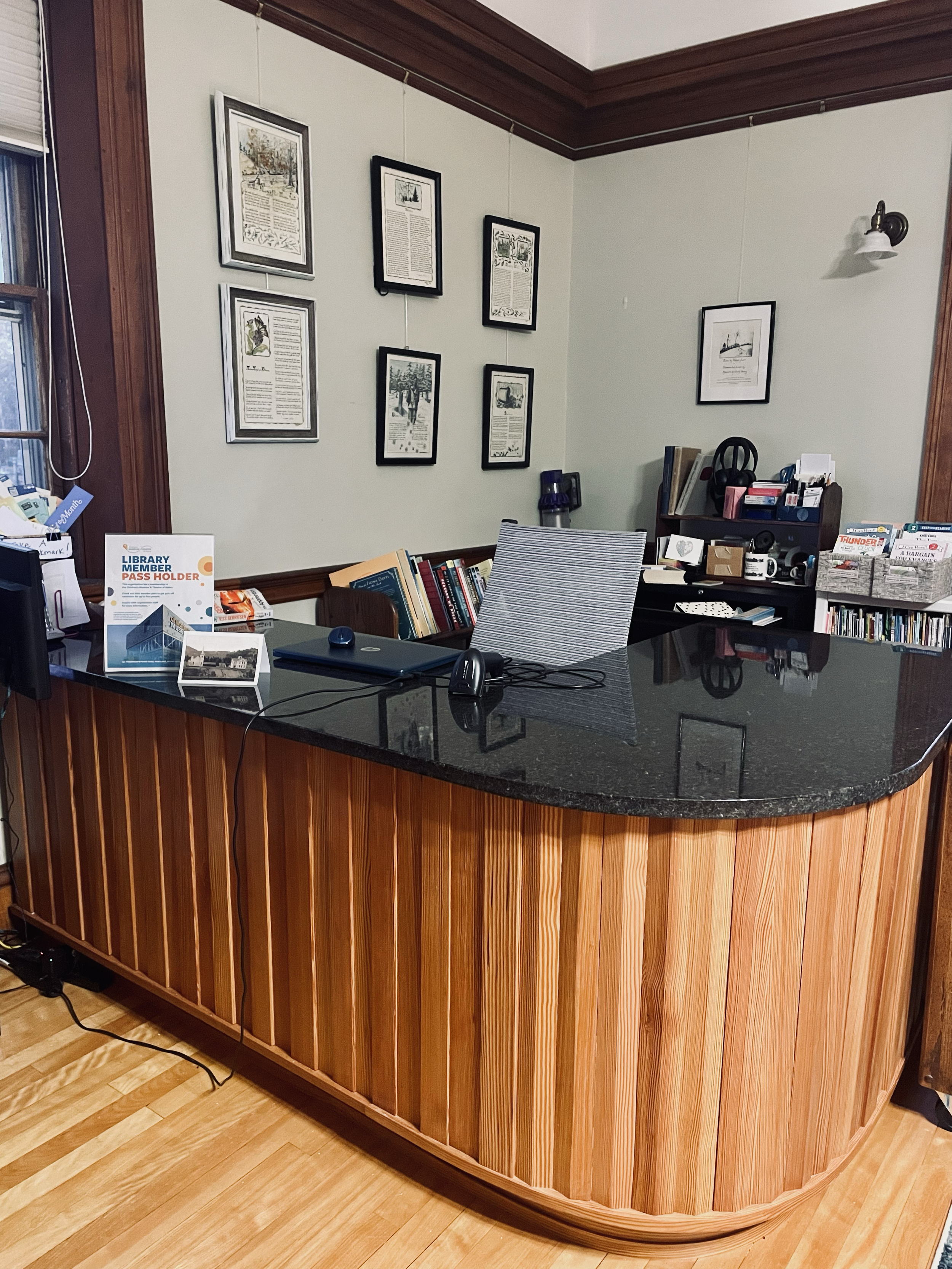 The new circulation desk was built by Henry Banks of Tear Cap Workshops; reclaimed 1800s southern yellow pine and a granite top provides  a beautiful addition to our historic building!