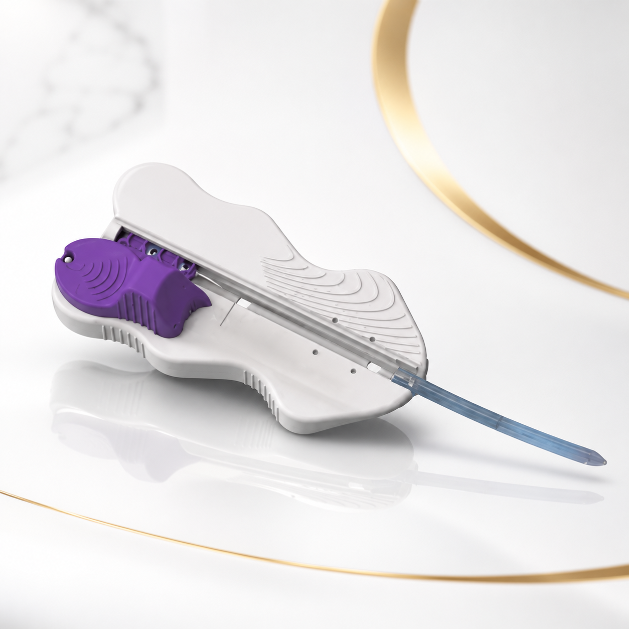 A fish-shaped ultrasound probe with a purple fish detail, connected to a thin blue cable, placed on a white surface next to a gold-ringed white dish.