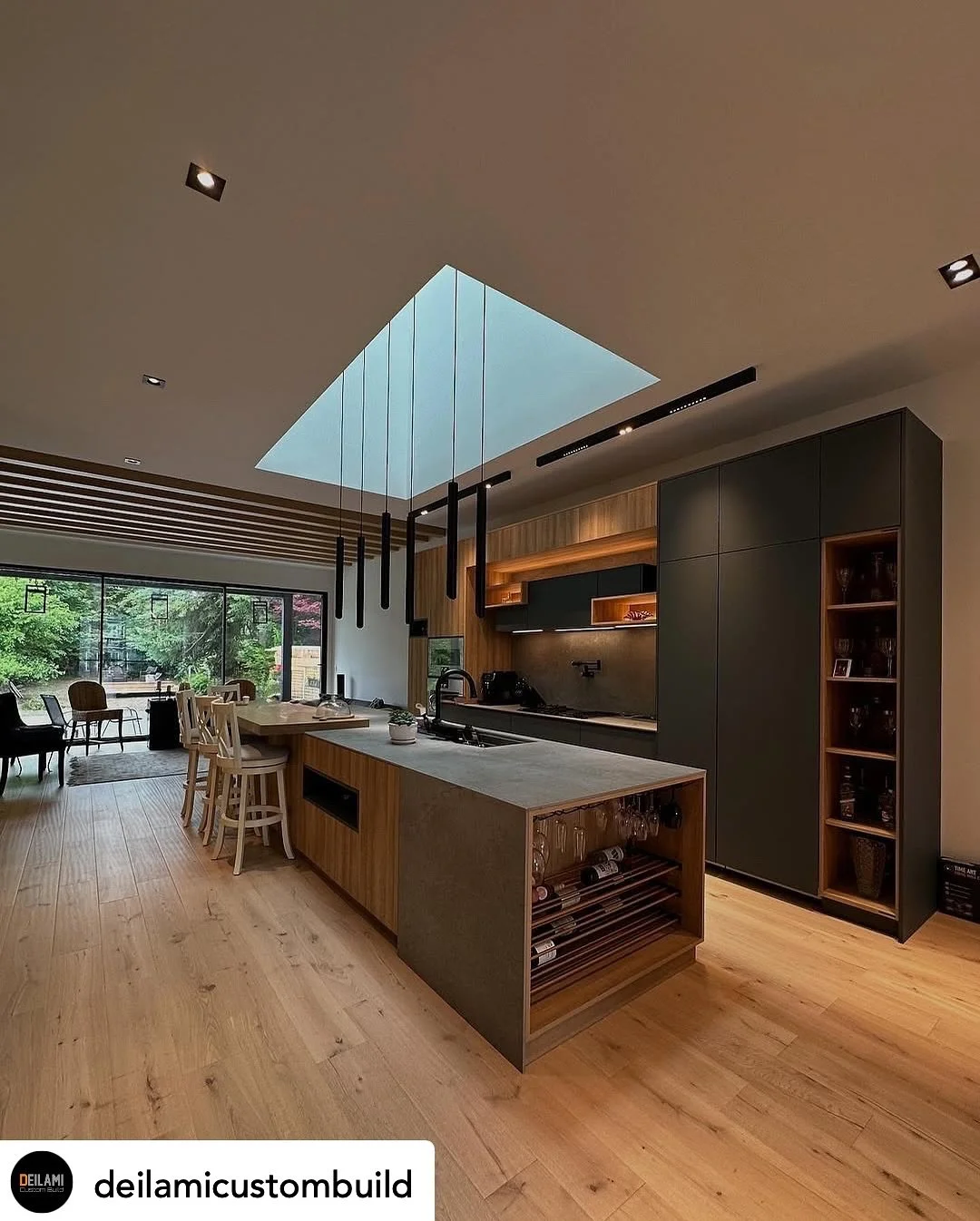 ✨ Where modern engineering meets timeless design - our latest custom build masterpiece seamlessly blends form and function. This 13-foot kitchen island, featuring handless cabinetry, flows effortlessly into a striking 17-foot wall unit, creating a co
