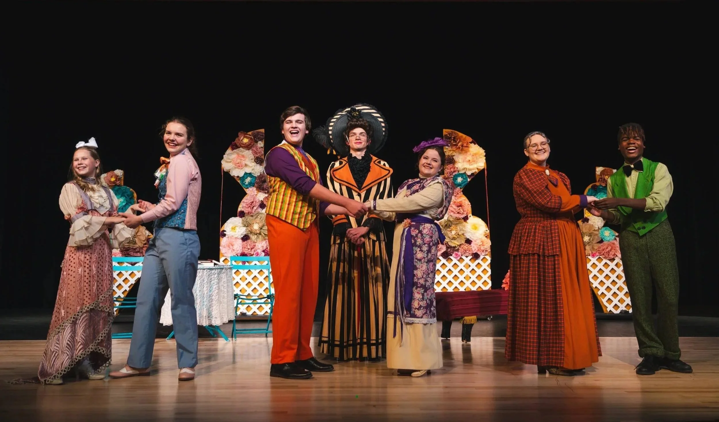 High school students on stage performing in The Costume Collective's pieces forThe Importance of Being Earnest (Prescott High School, 2023)