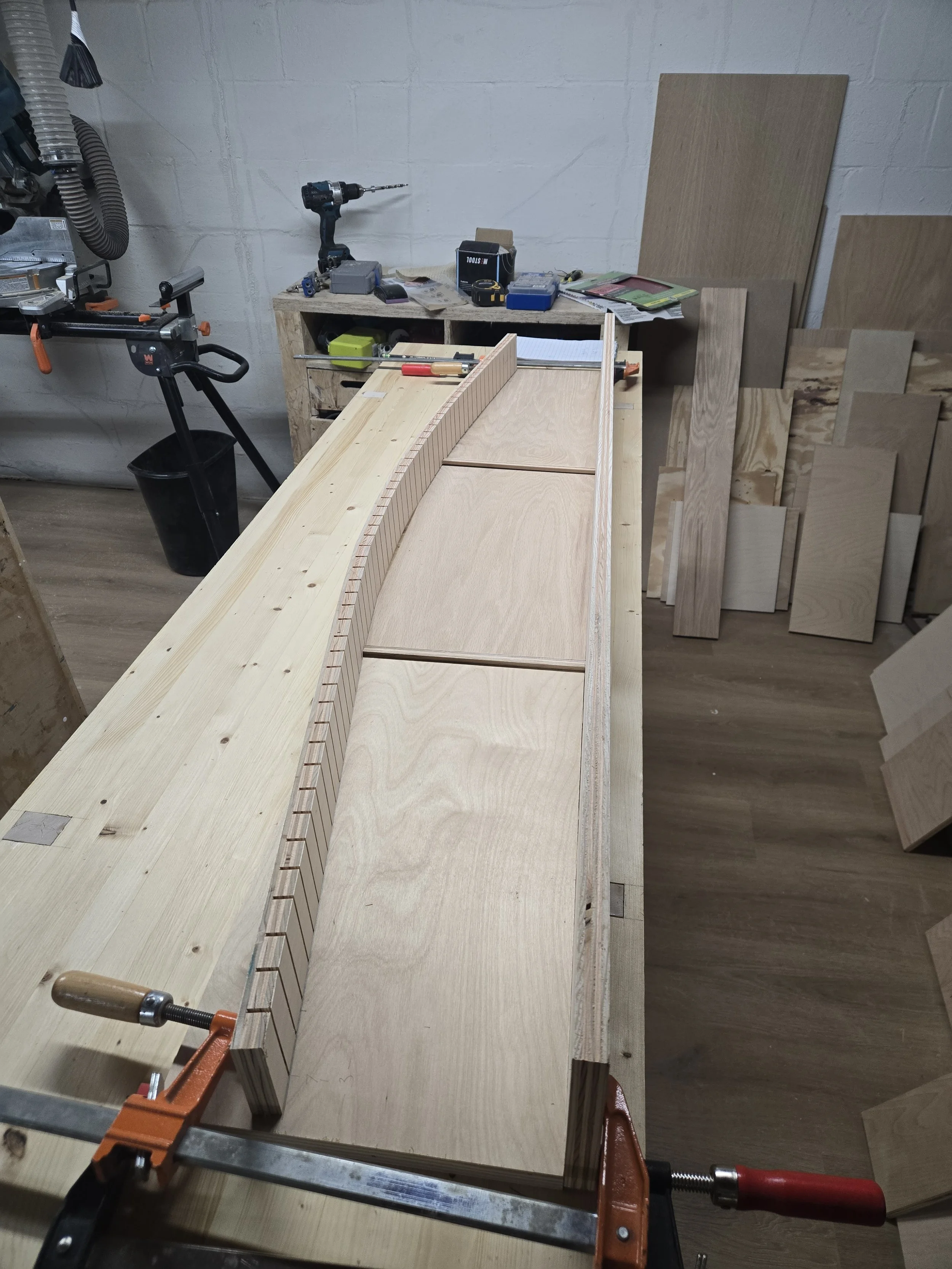 The shelf is cut at a curve and the front lip is formed to that curve
