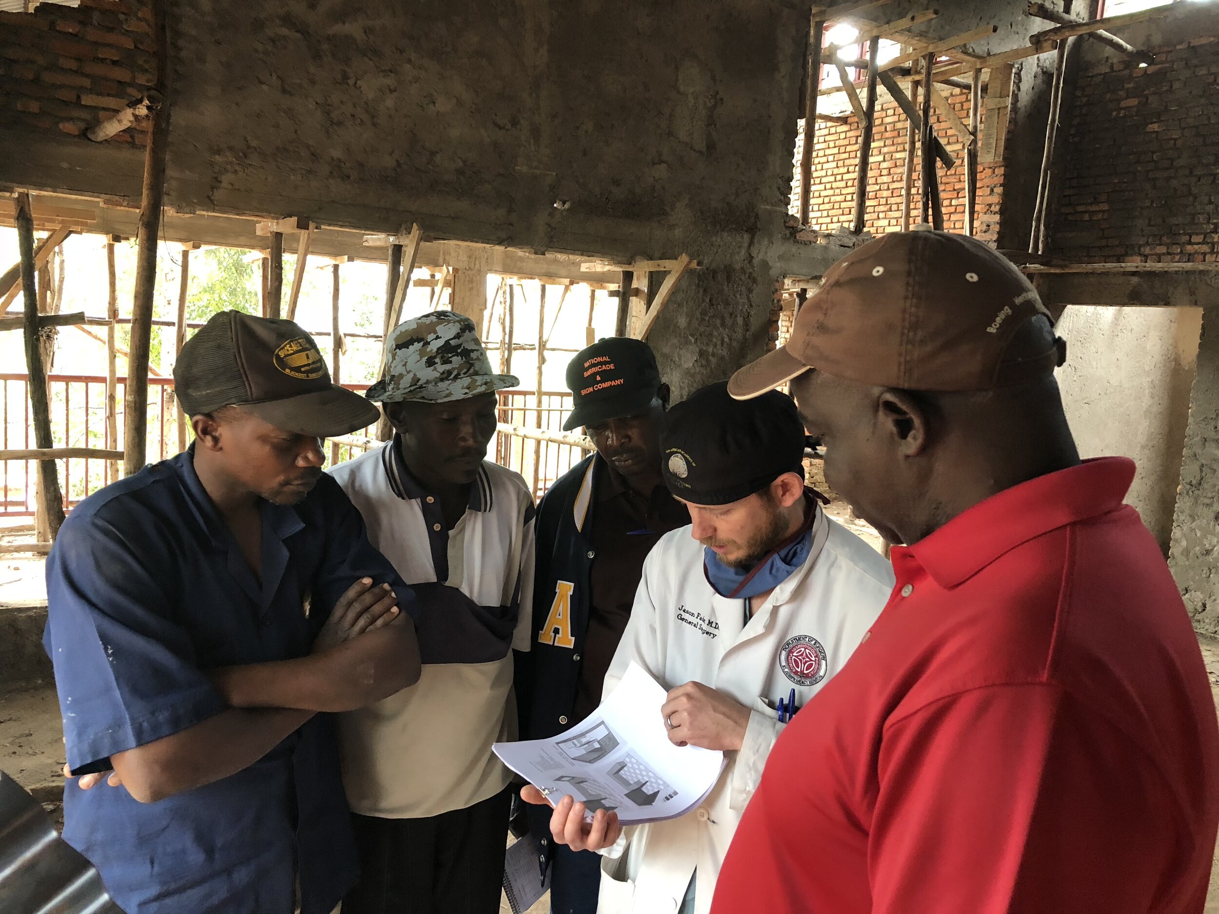  Discussing plans with a local construction team. Kibuye has continuously employed approximately 250 full time local masons, carpenters, welders, and other tradesmen. 