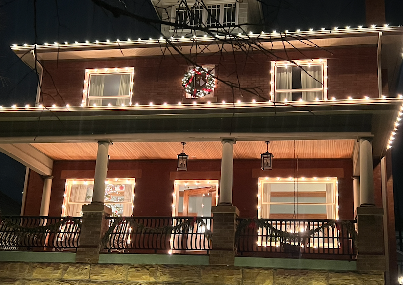 Neighborhood home with Christmas lights representing finding the Christmas spirit in everyday moments