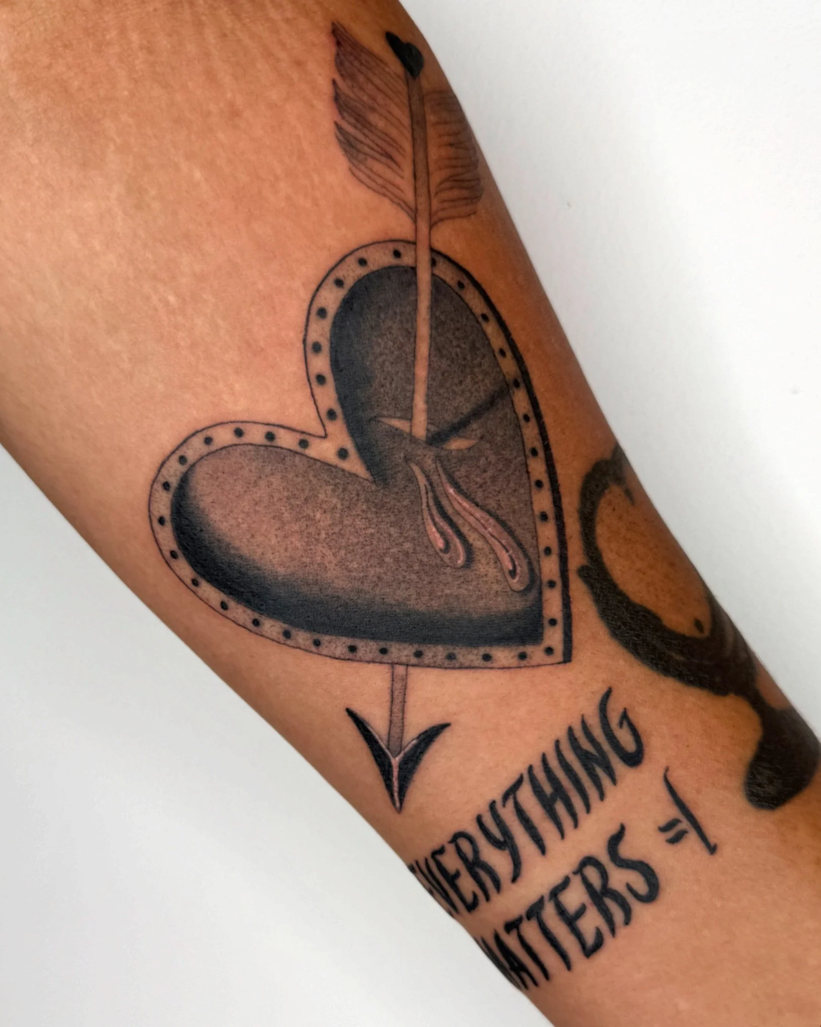 traditional heart fineline black and grey tattoo heart arrow