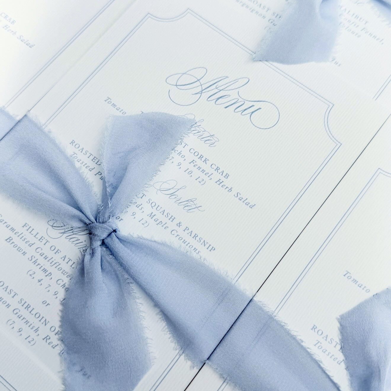 Absolutely love seeing Scriptique used by the incredibly talented @theivoryfeatherdesigns on these beautiful wedding menus.

The delicate ribbon + those gorgeous flourishes 😍 Just perfect.

Using one of my fonts in your work? Tag me or send me your 