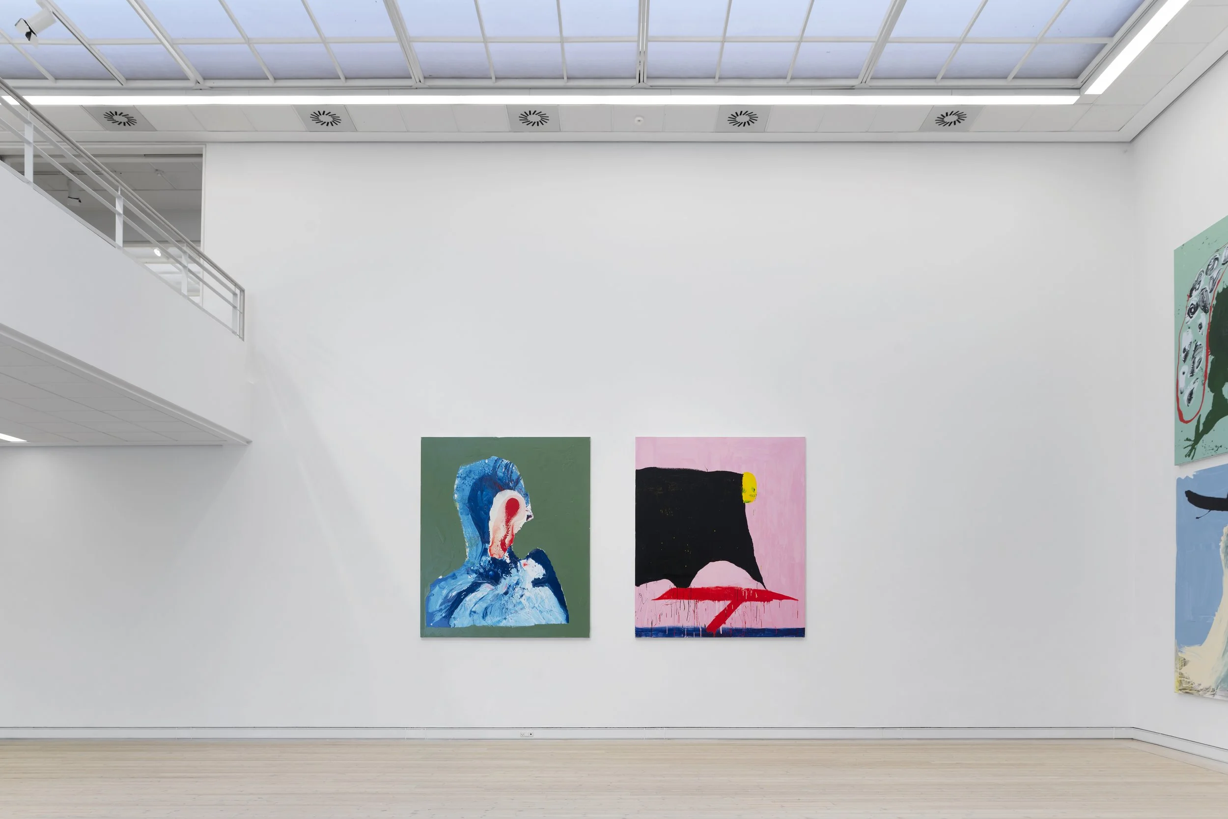 Art gallery with colorful abstract paintings on white walls and wooden floor, ceiling with skylights. Frederik Næblerød Time to Move exhibition at  Horsens Art museum Kunstmuseum, Denmark.
