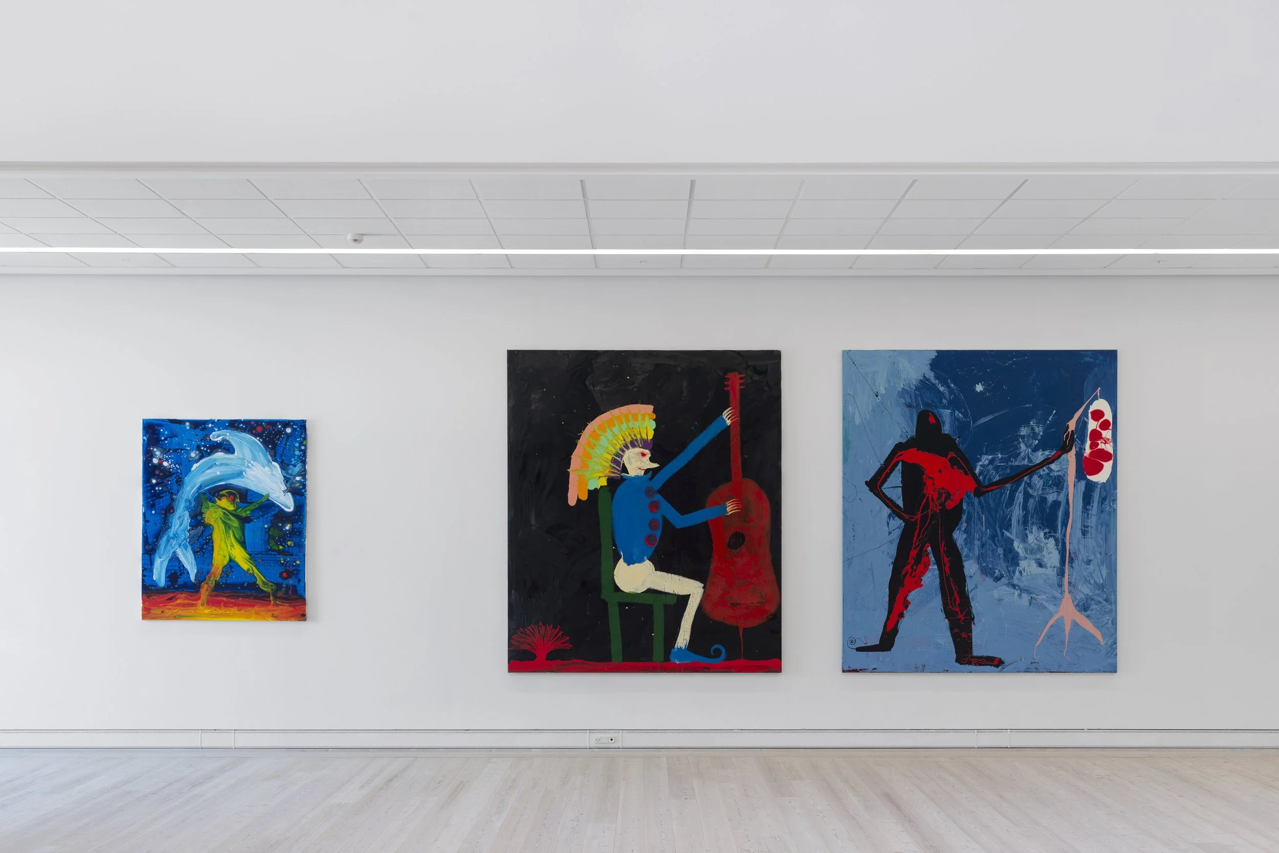 Three colorful paintings displayed on a white gallery wall, depicting abstract and stylized figures: a dolphin with a person, a seated musician with a guitar and vibrantly colored headdress, Frederik Næblerød Time to Move exhibition at  Horsens Art m