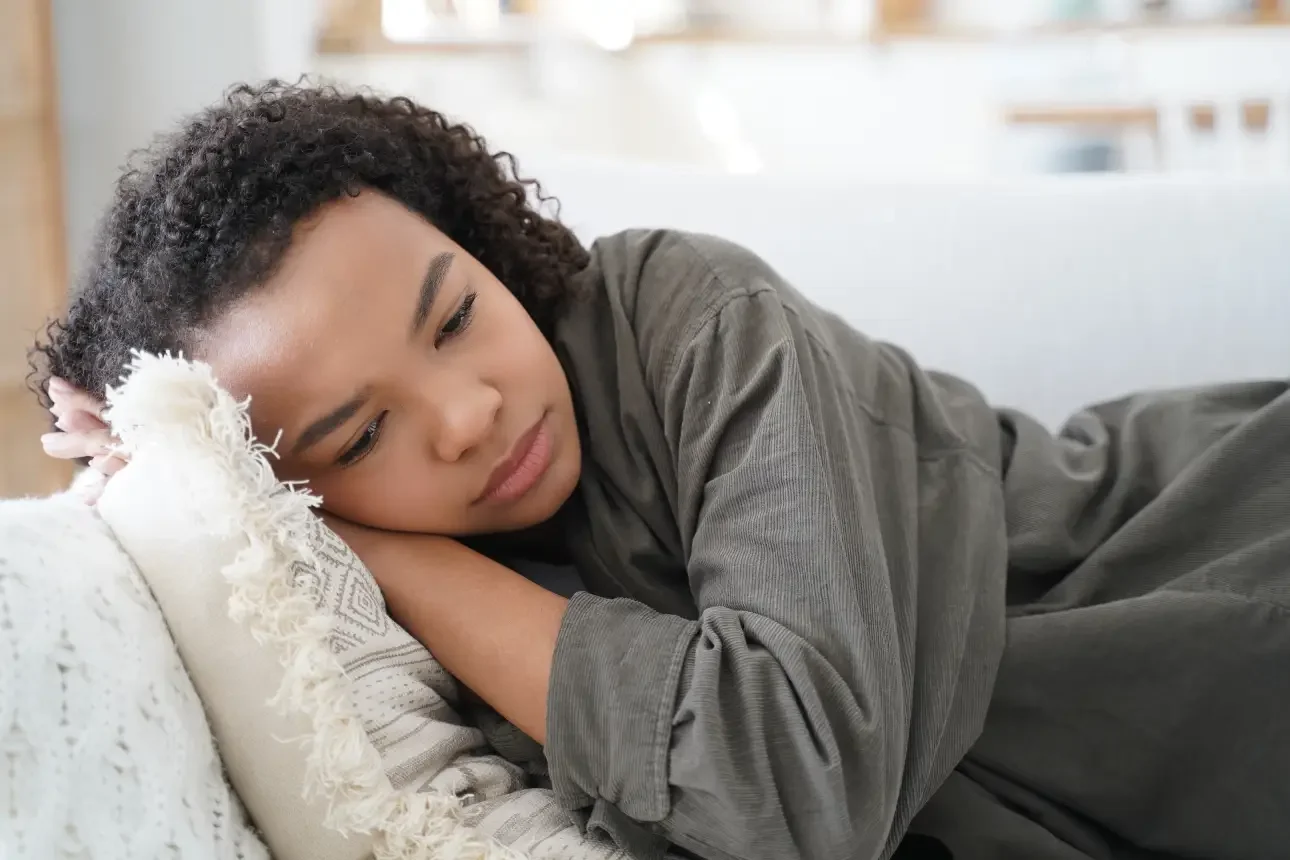 a teenager having a hard time sleeping on the couch in need of a teenager psychologist in Singapore