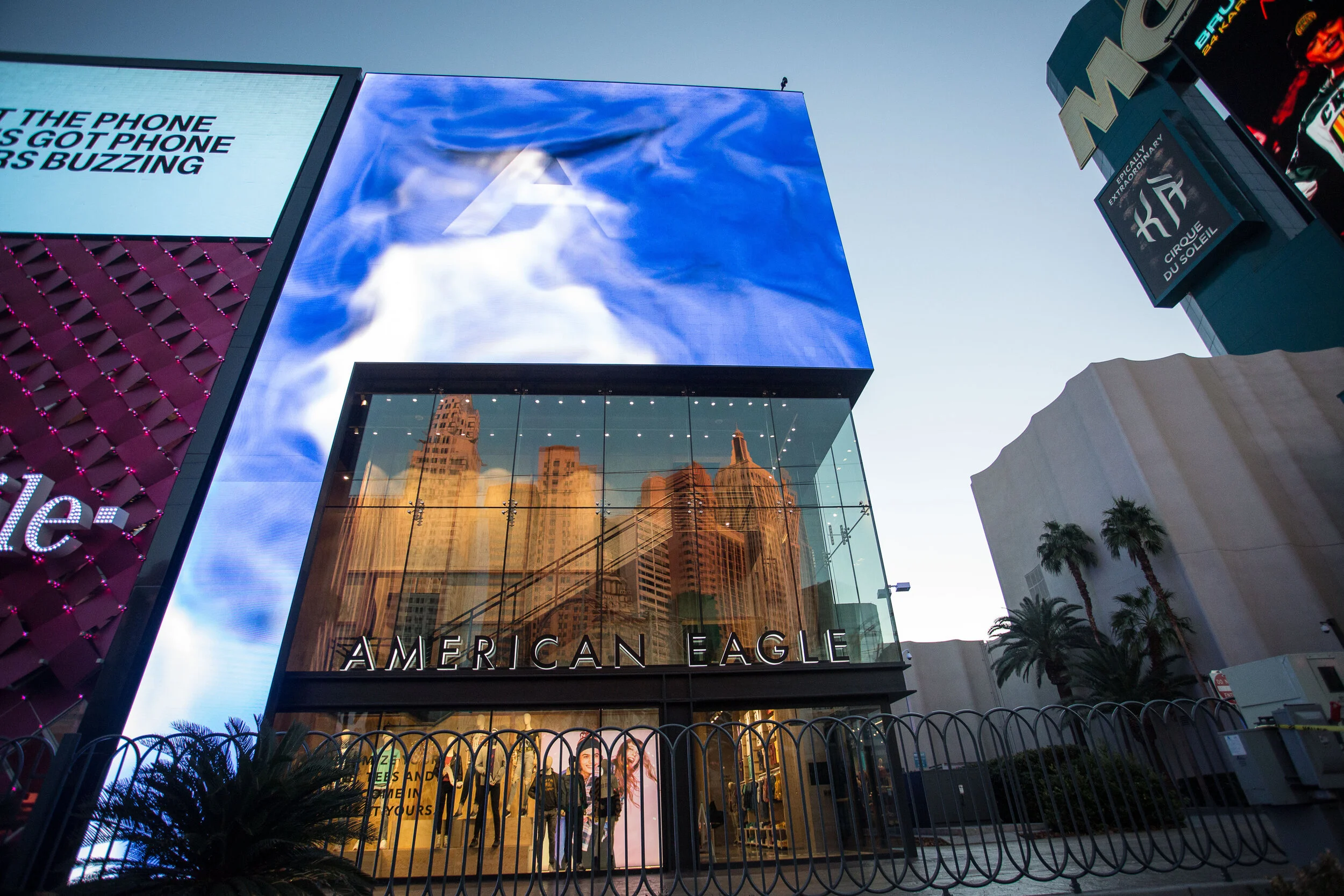 Night-time exterior view of the American Eagle Flagship Store Las Vegas with illuminated branding and digital facade.