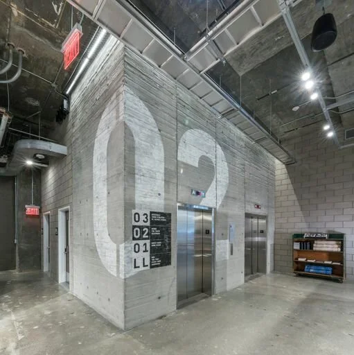 Shuttered concrete wall with large scale number two stencil Adidas Flagship NYC