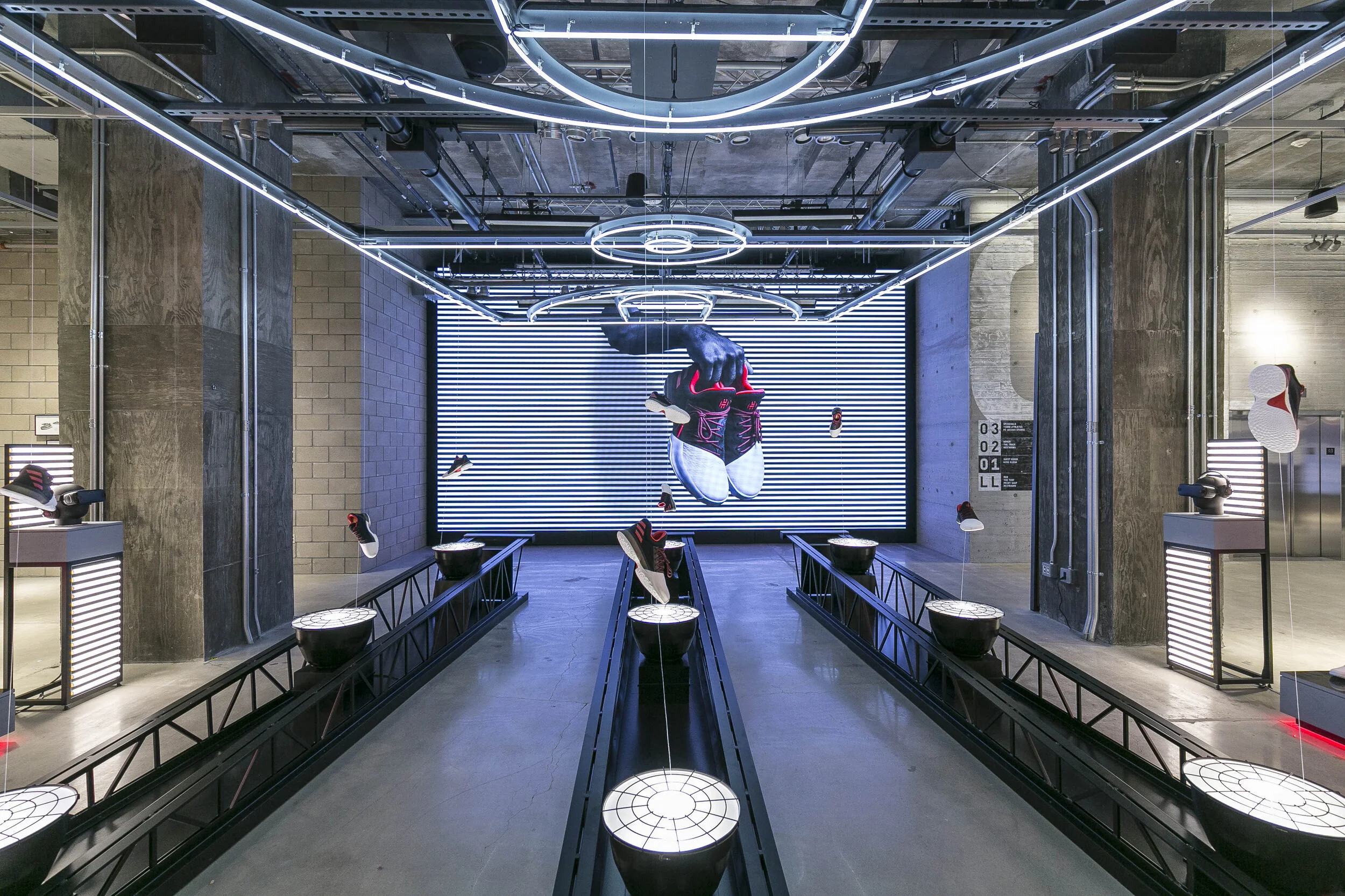 Immersive suspended footwear installation at Adidas Flagship NYC