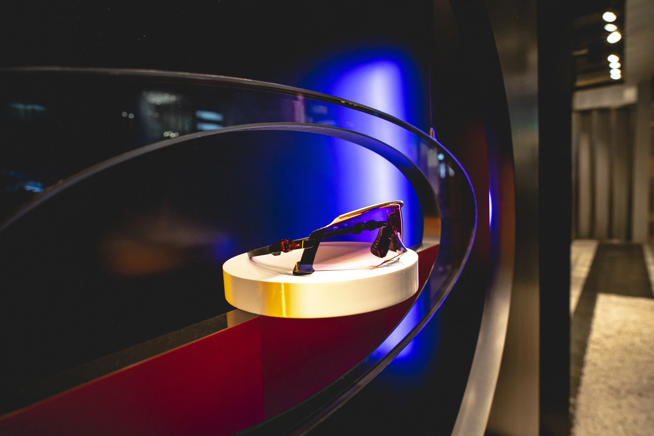 Feature plinth showcasing Oakley performance sunglasses within the Shibuya flagship store