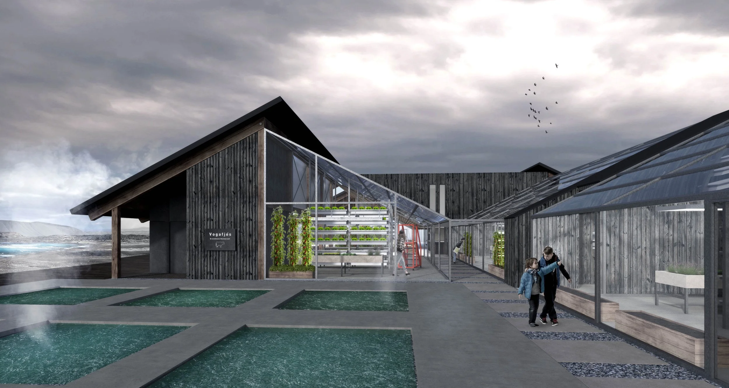 Exterior view of the Greenhouse Restaurant Iceland featuring timber buildings, glass greenhouses, and planted courtyards.