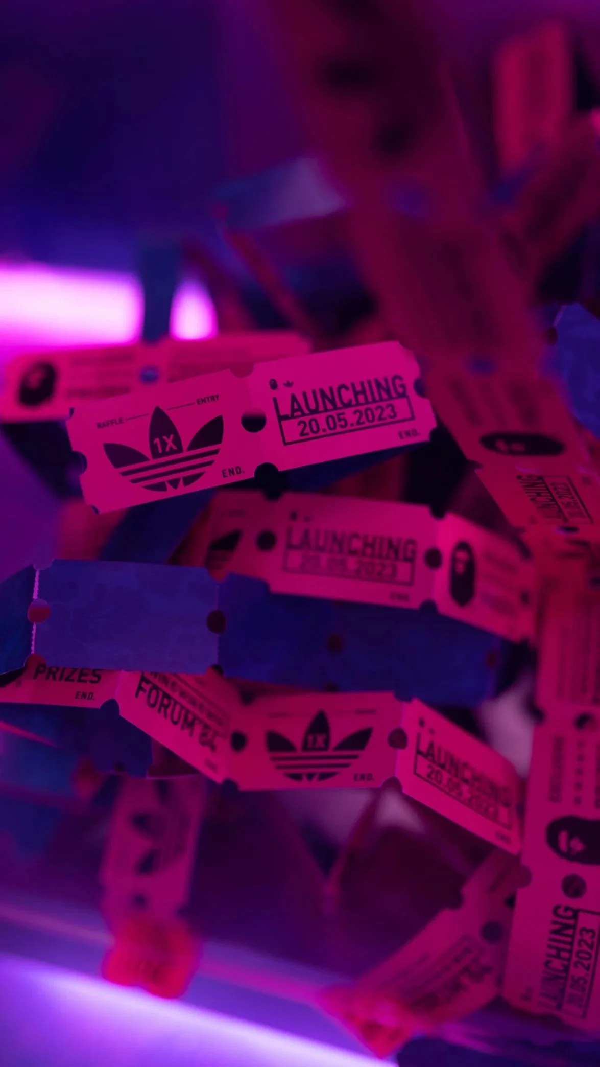 Adidas x BAPE pink and blue branded arcade tickets