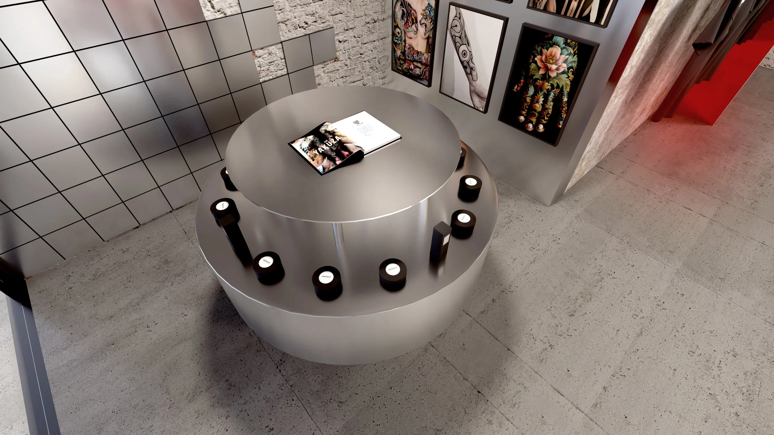 Top-down view of Inkhaus Tattoo Studio Berlin round counter with branded product jars and book display.
