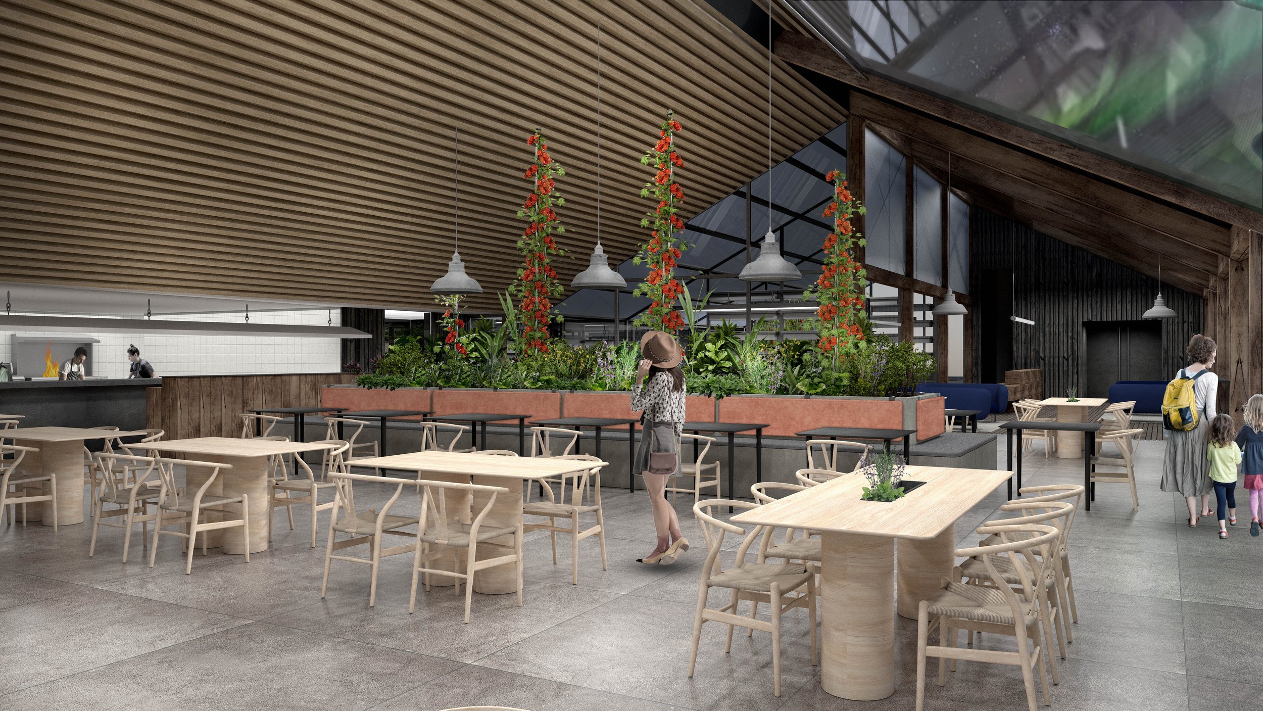 Main dining hall of the Greenhouse Restaurant Iceland with central planting, timber finishes, and open kitchen.