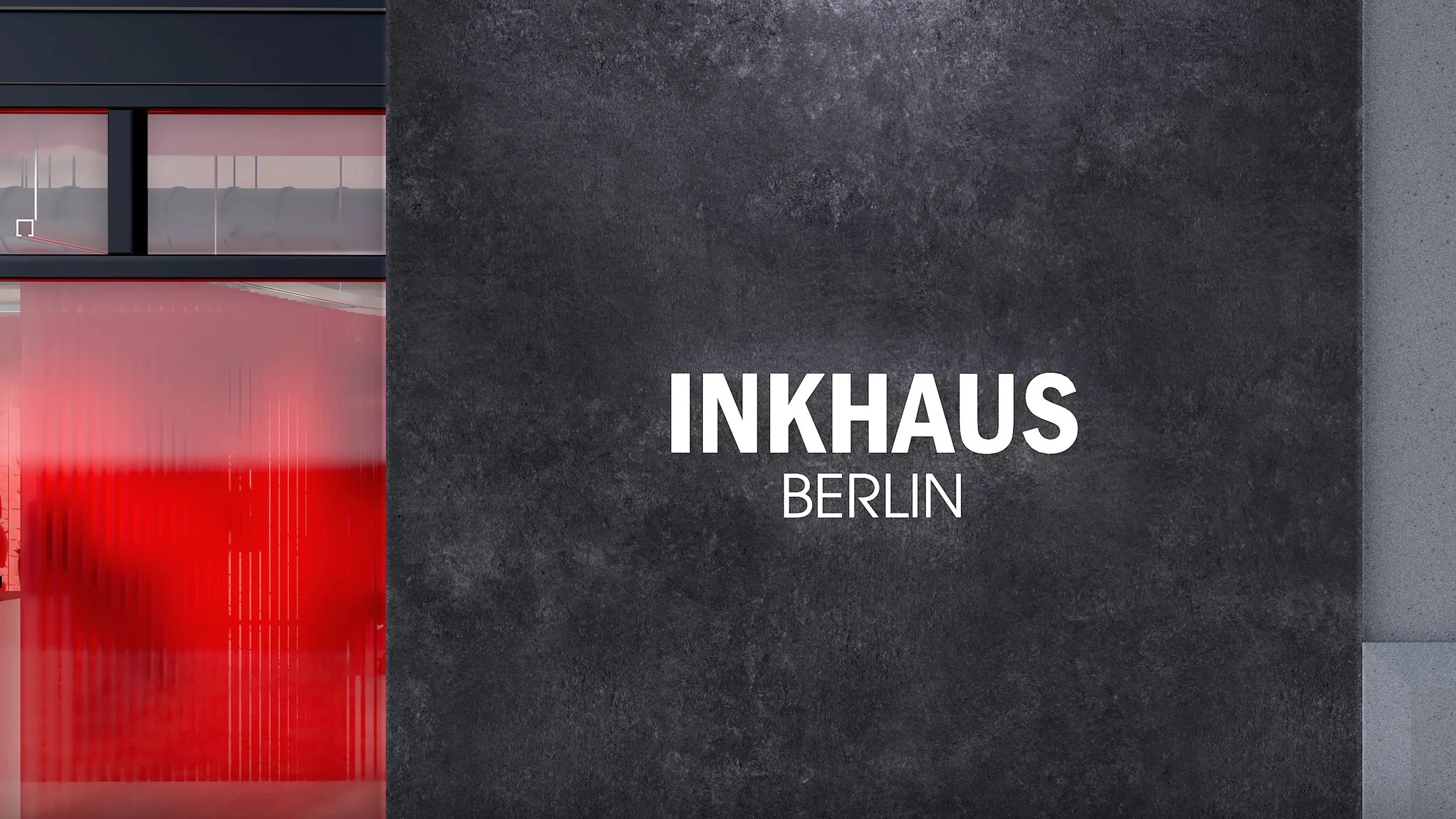 Close-up of the INKHAUS BERLIN logo on the studio dark exterior wall in Berlin.