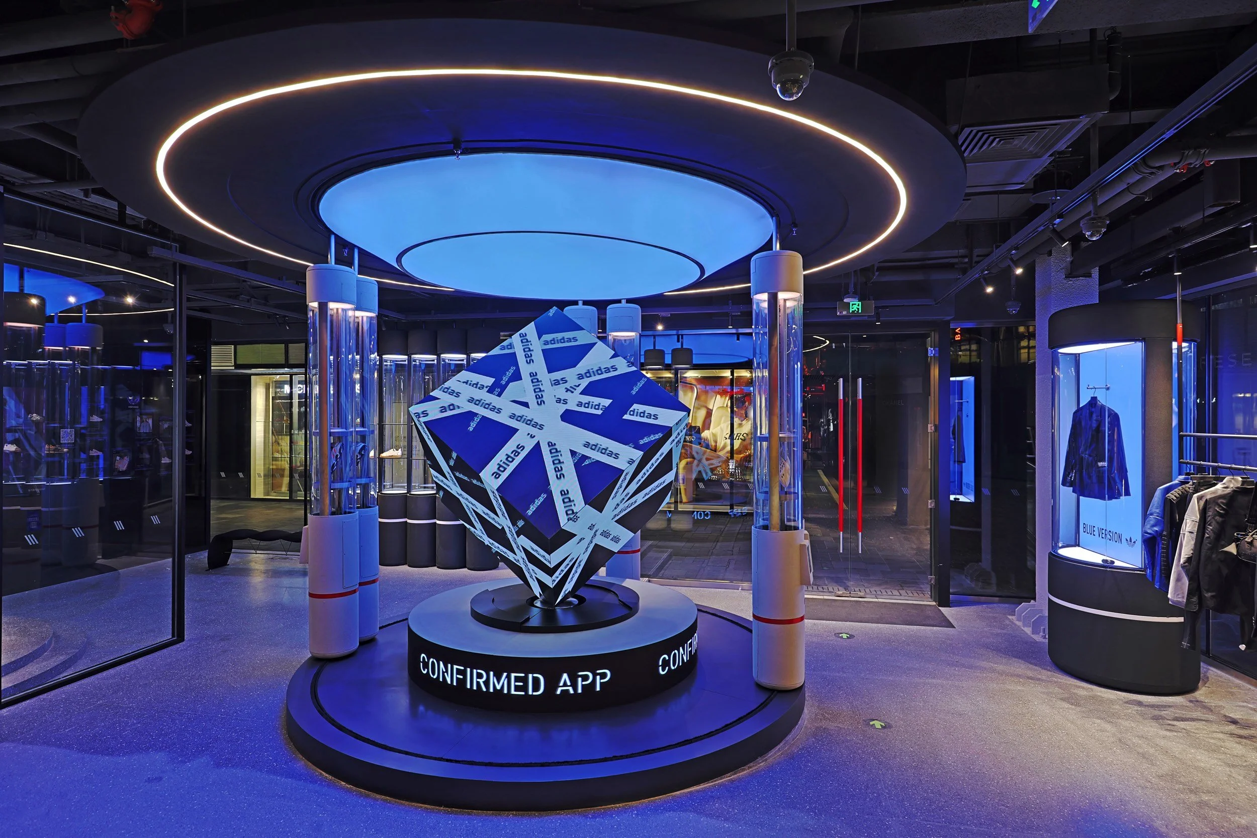 Confirmed App immersive cube installation inside the Adidas Flagship Sanlitun Beijing with dynamic lighting and digital branding.