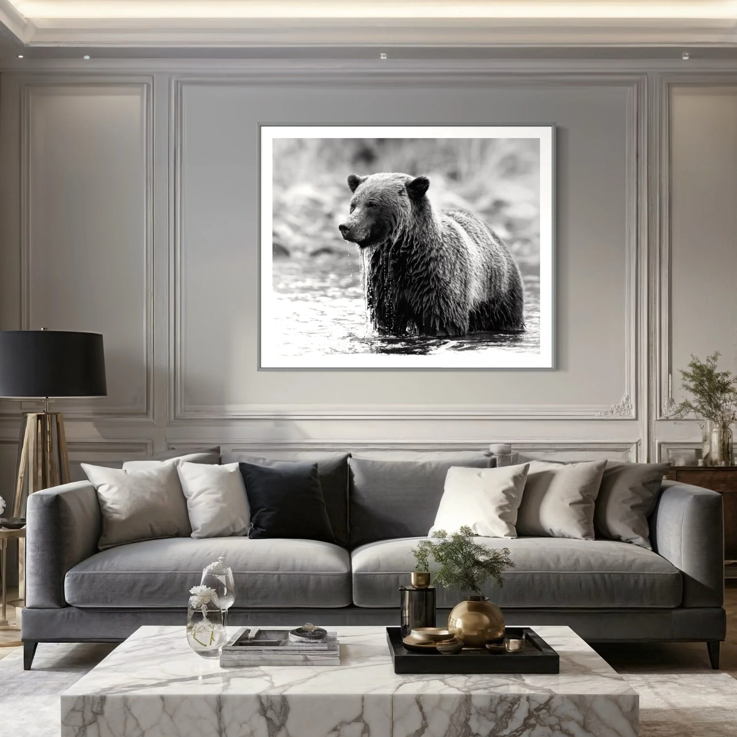 Elegant living room with a gray sofa and large framed black-and-white photo of a bear on the wall.