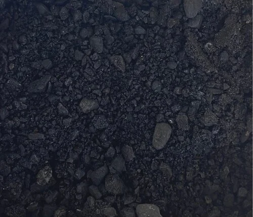 Close-up of black gravel or asphalt mix.