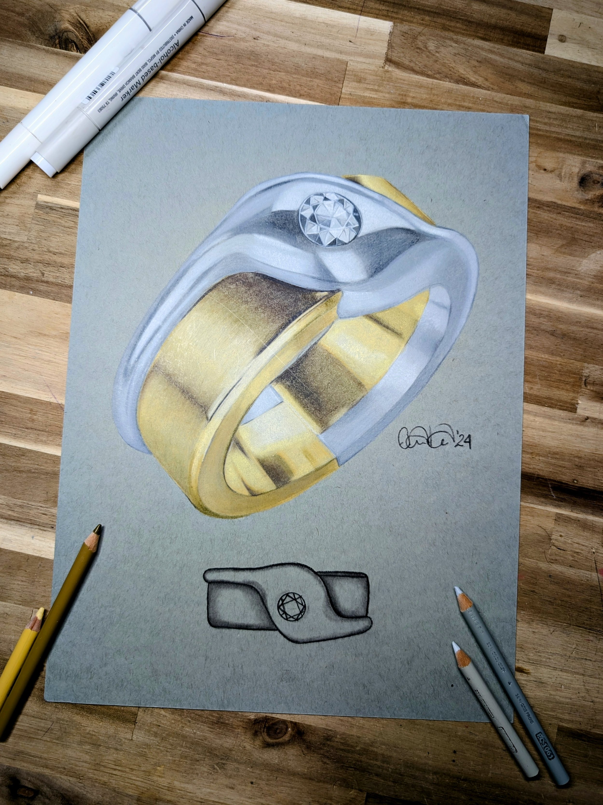 Colorful drawing of a ring with gold and silver bands and a diamond on a textured background, surrounded by colored pencils.