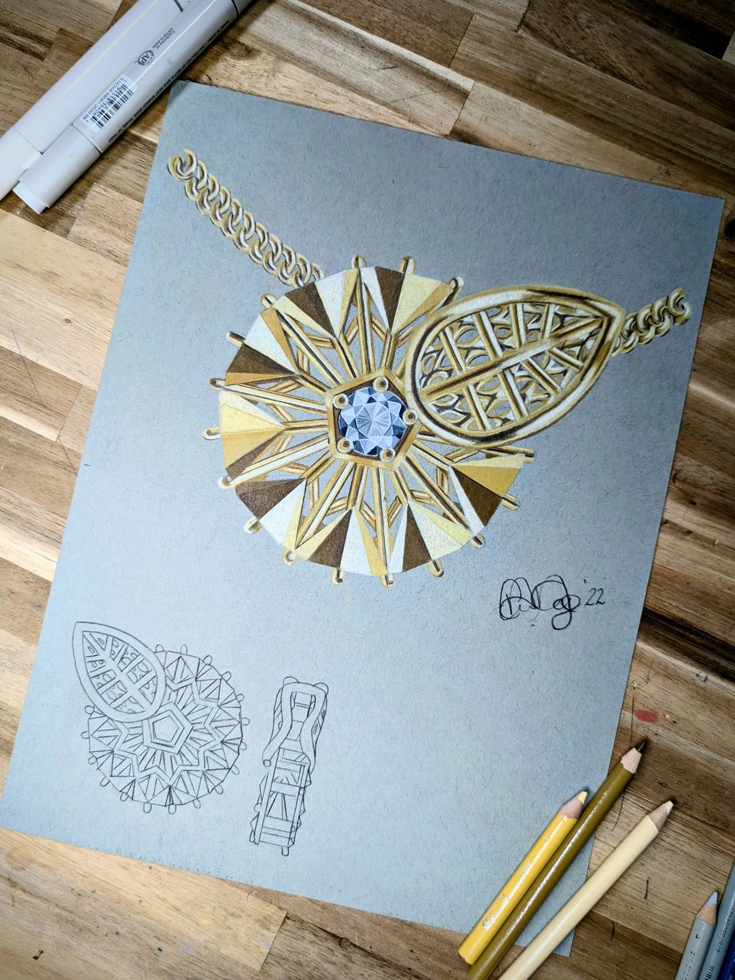 Drawing of a gold necklace with a large, intricate, geometric pendant, featuring a central gem and detailed latticework, along with sketches of the pendant's design and chain.