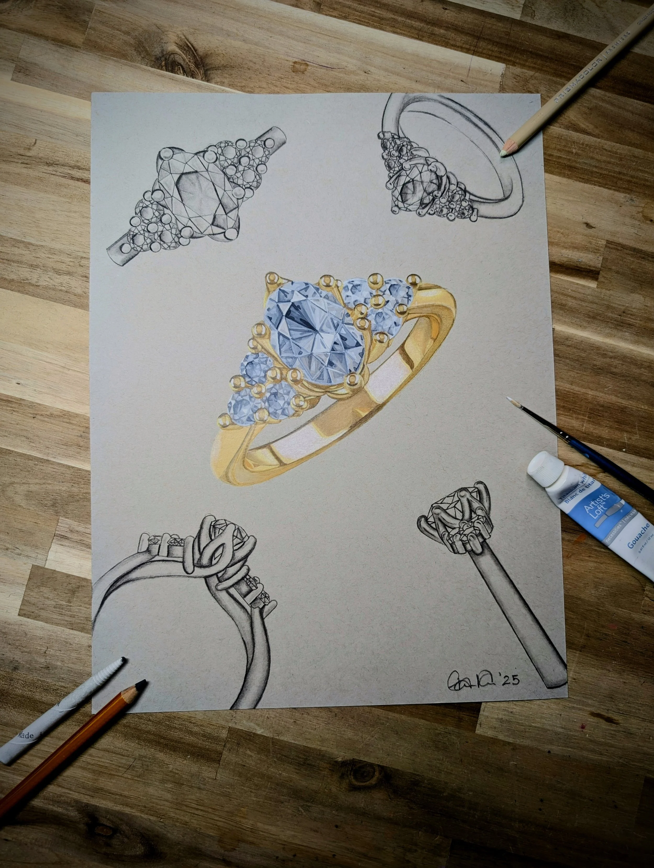 A detailed illustration of a ring design featuring a large central diamond with smaller surrounding diamonds. The drawing includes sketches of the ring from different angles, with some parts in black and white and others colored, and art supplies lik