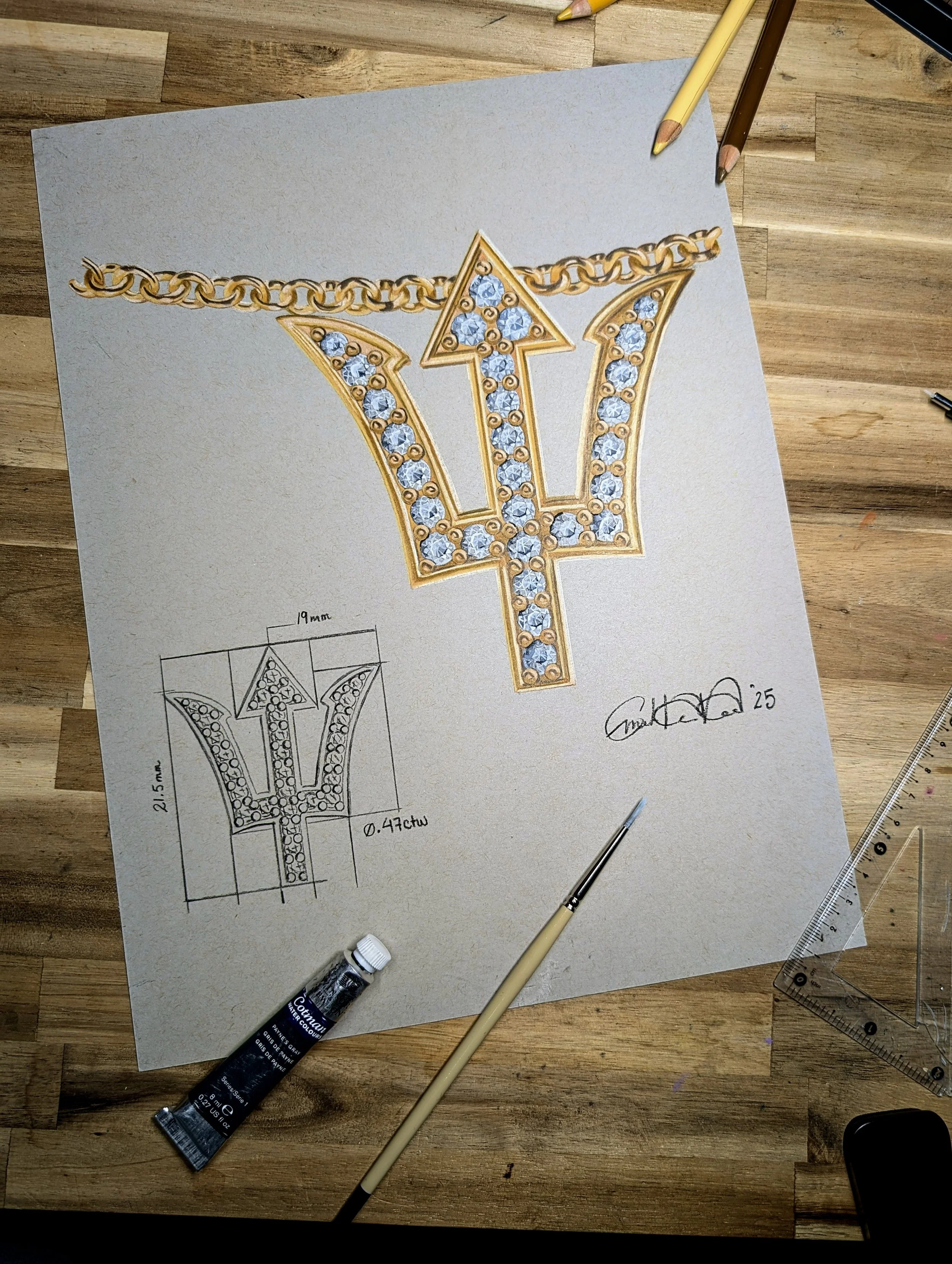 Design sketch of a jewelry piece featuring a large trident symbol decorated with diamonds and gold outlines. The jewelry also includes a gold chain, and the sketch shows detailed measurements and design notes.
