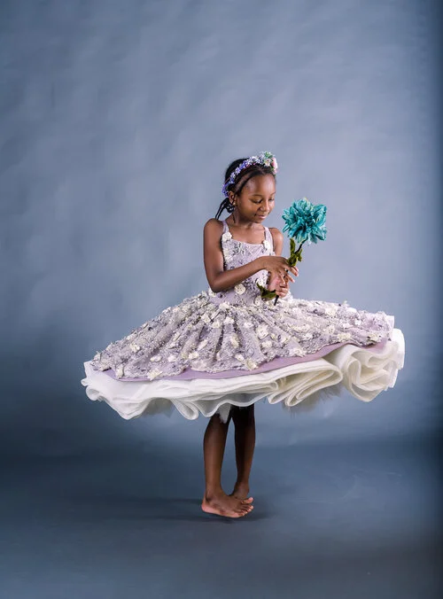 6+year+old+holding+teal+flowers+in+purple+dusty+dress+at+Seraphine+Photography+Studio+in+Randolph+MA-3707.jpg