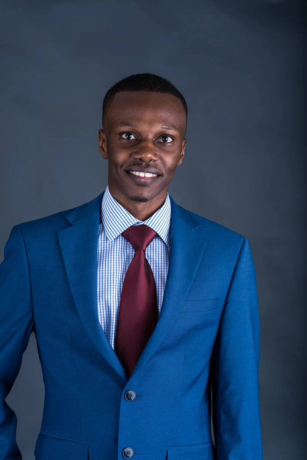 Business Portrait of a young Executive grey background-.jpg