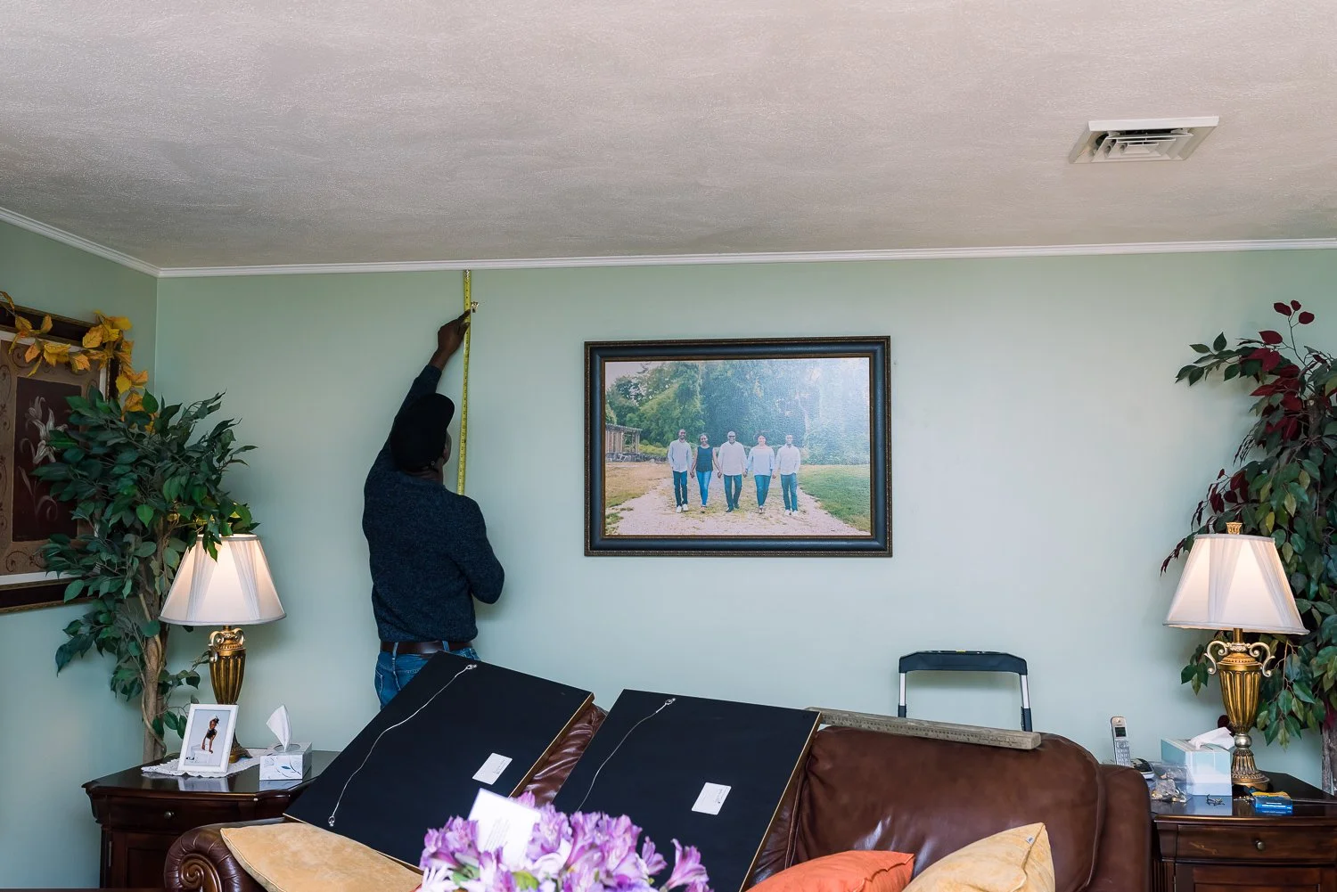 Installing Wall portraits on a clients wall 