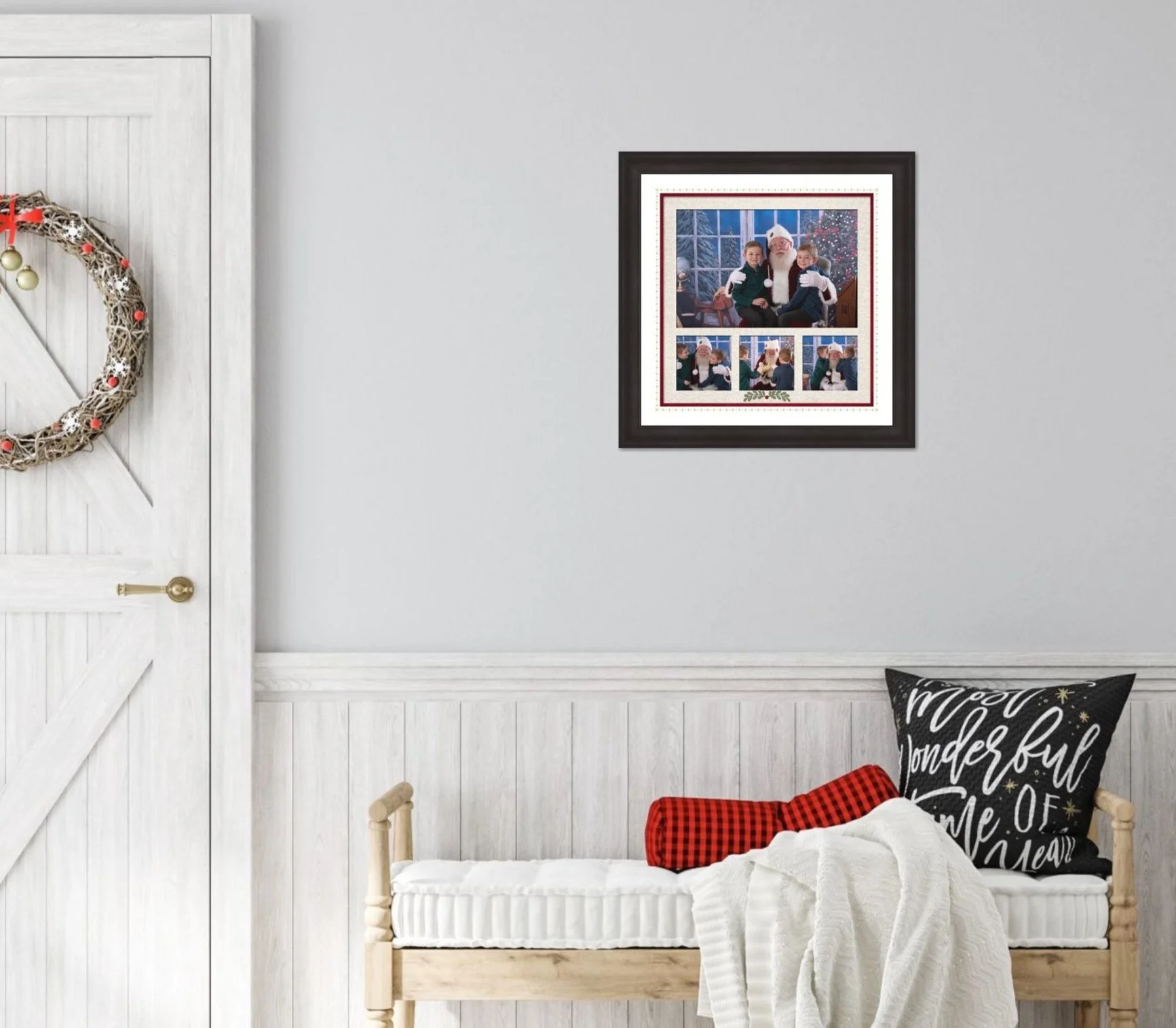A cozy room with a white bench, decorative pillow, and blanket. A framed photo collage with Christmas pictures hangs on the wall, next to a closed white wooden door adorned with a festive wreath.